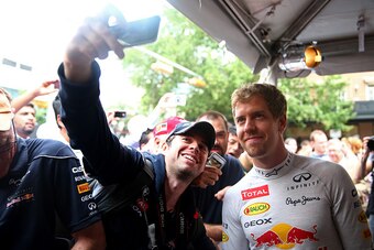 AUSTIN, TX - OCTOBER 29:  Sebastian Vettel of Germany and Infiniti Red Bull Racing poses with fans during previews ahead of the United States Formula One Grand Prix on the streets of Austin on October 29, 2014 in Austin, United States.  (Photo by Mark Tho