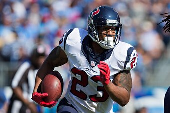 NASHVILLE, TN - OCTOBER 26:  Arian Foster #23 of the Houston Texans runs the ball against the Tennessee Titans at LP Field on October 26, 2014 in Nashville, Tennessee.  The Texans defeated the Titans 30-16.  (Photo by Wesley Hitt/Getty Images)
