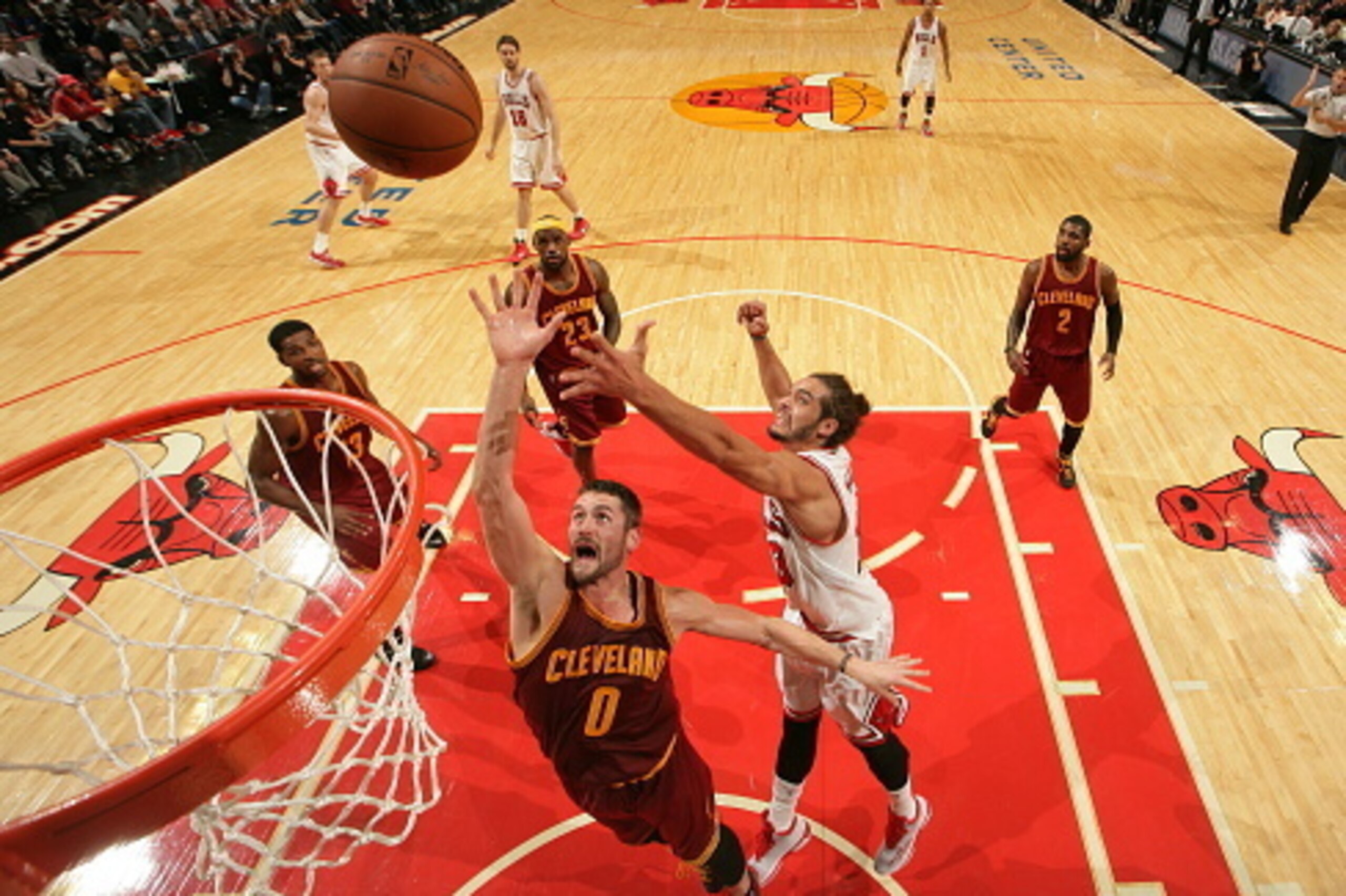 CHICAGO, IL - OCTOBER 31:  Kevin Love #0 of the Cleveland Cavaliers and Joakim Noah #13 of the Chicago Bulls go up for a rebound during a game at the United Center  on October 31, 2014 in Chicago, Illinois. NOTE TO USER: User expressly acknowledges and ag