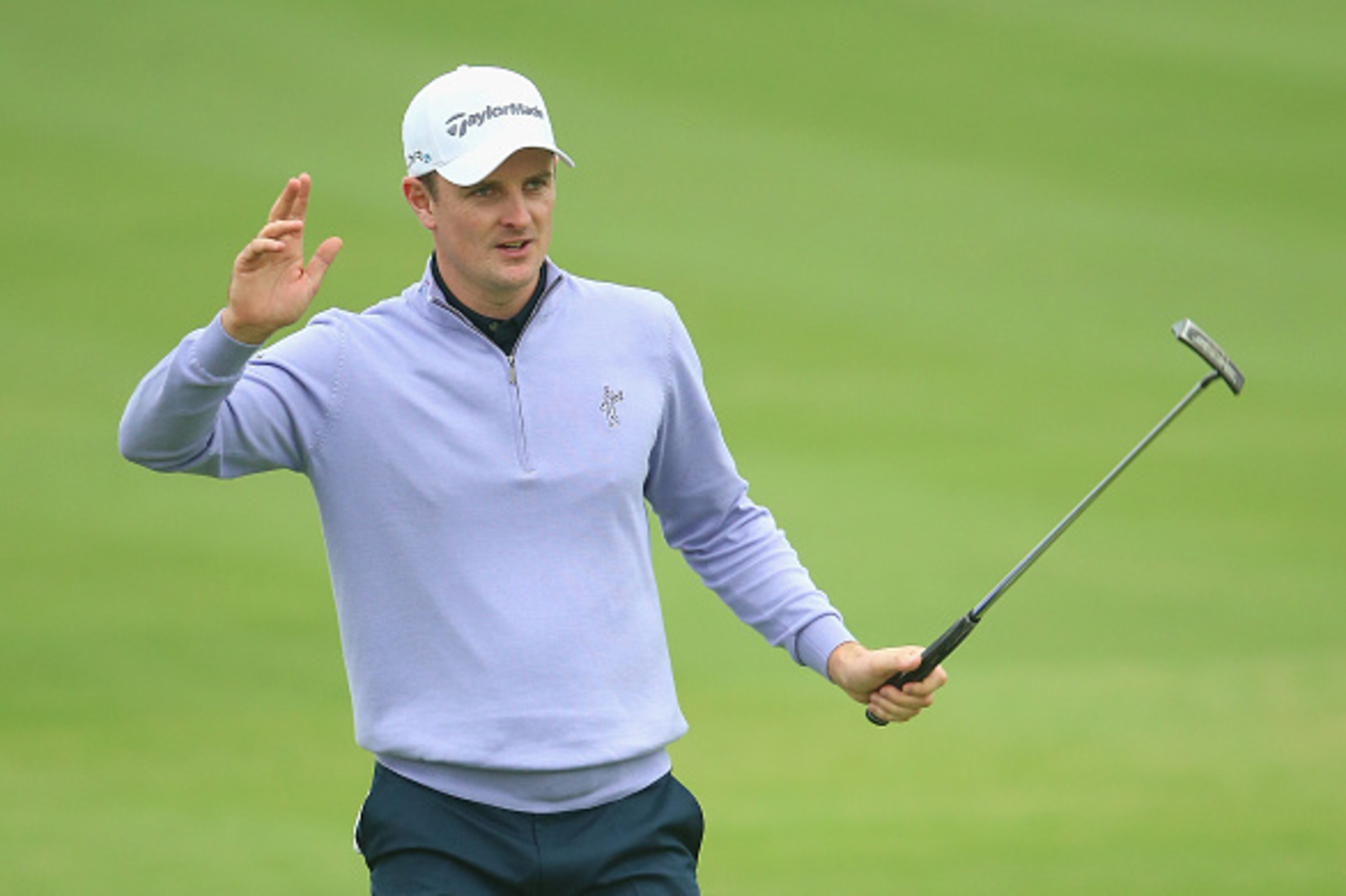 SHANGHAI, CHINA - NOVEMBER 01:  Justin Rose of England celebrates after holing a birdie putt on the 14th hole during the third round of the BMW Masters at Lake Malaren Golf Club on November 1, 2014 in Shanghai, China.  (Photo by Andrew Redington/Getty Ima