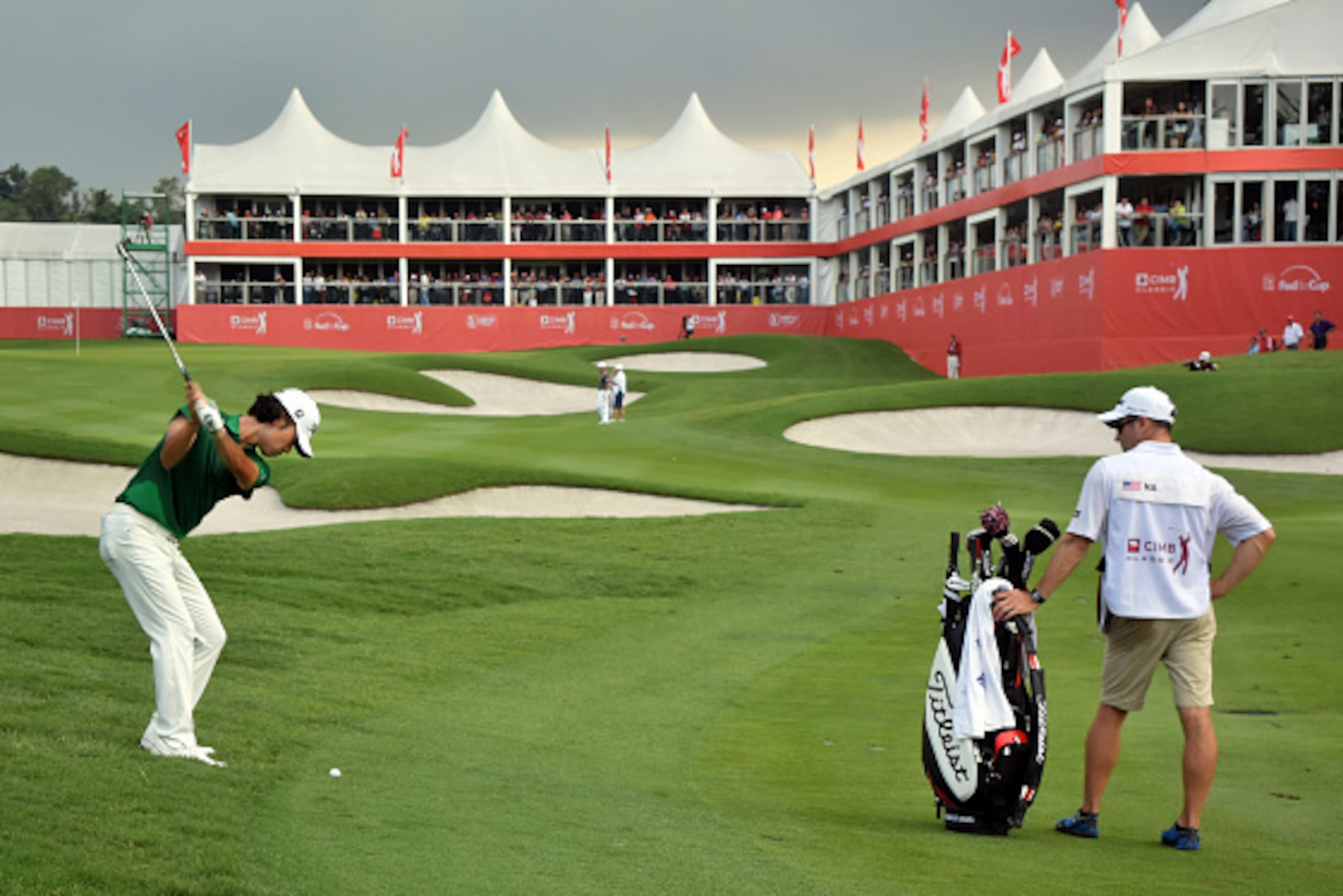 KUALA LUMPUR, MALAYSIA - NOVEMBER 01:  Kevin Na of United States plays his approaching shot on the 18th hole during day three of the 2014 CIMB Classic at Kuala Lumpur Golf & Country Club on November 1, 2014 in Kuala Lumpur, Malaysia.  (Photo by Stanley Ch
