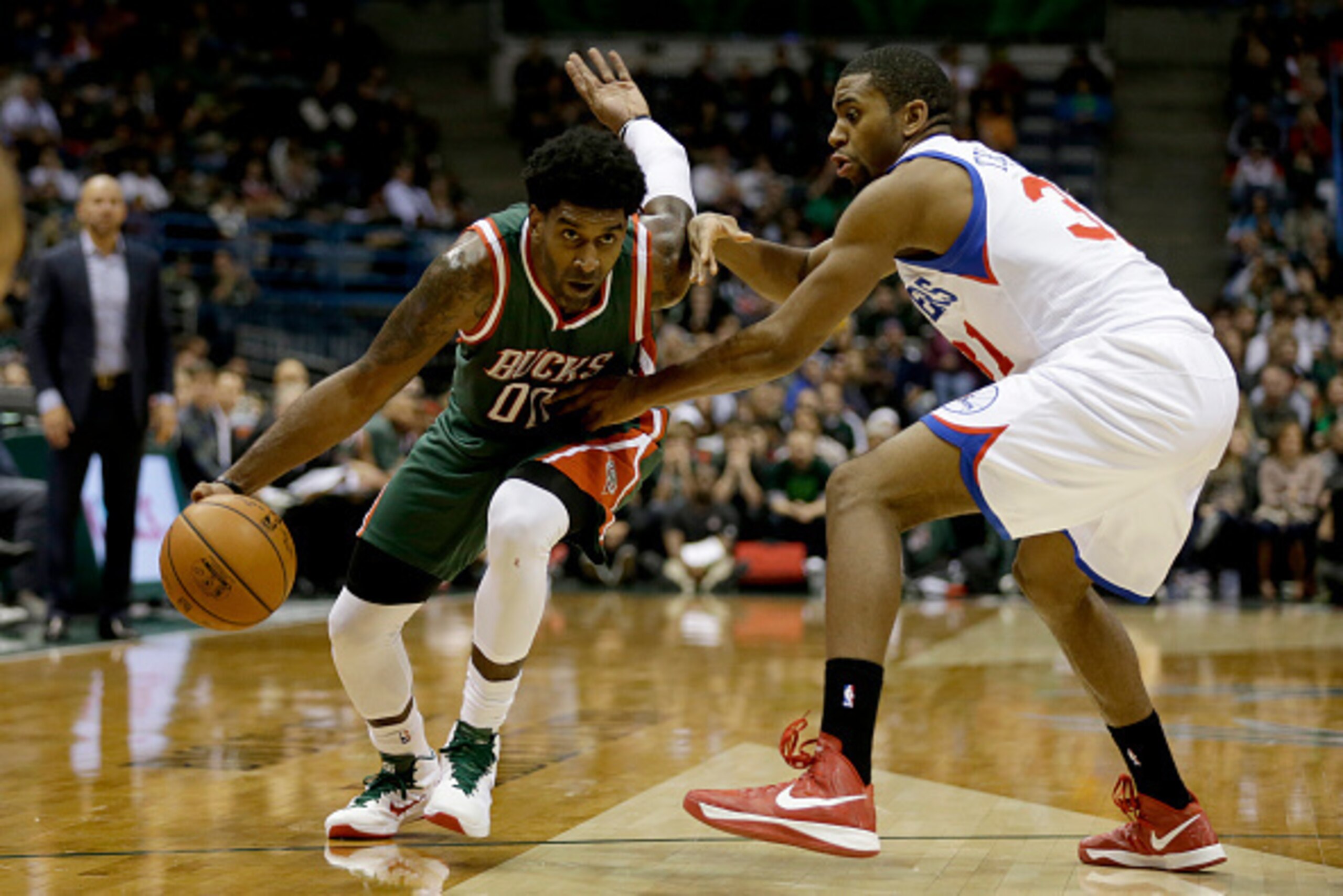 MILWAUKEE, WI - OCTOBER 31: O.J. Mayo #00 of the Milwaukee Bucks drives to the hoop during the second half against the Philadelphia 76ers at BMO Harris Bradley Center on October 31, 2014 in Milwaukee, Wisconsin. NOTE TO USER: User expressly acknowledges a