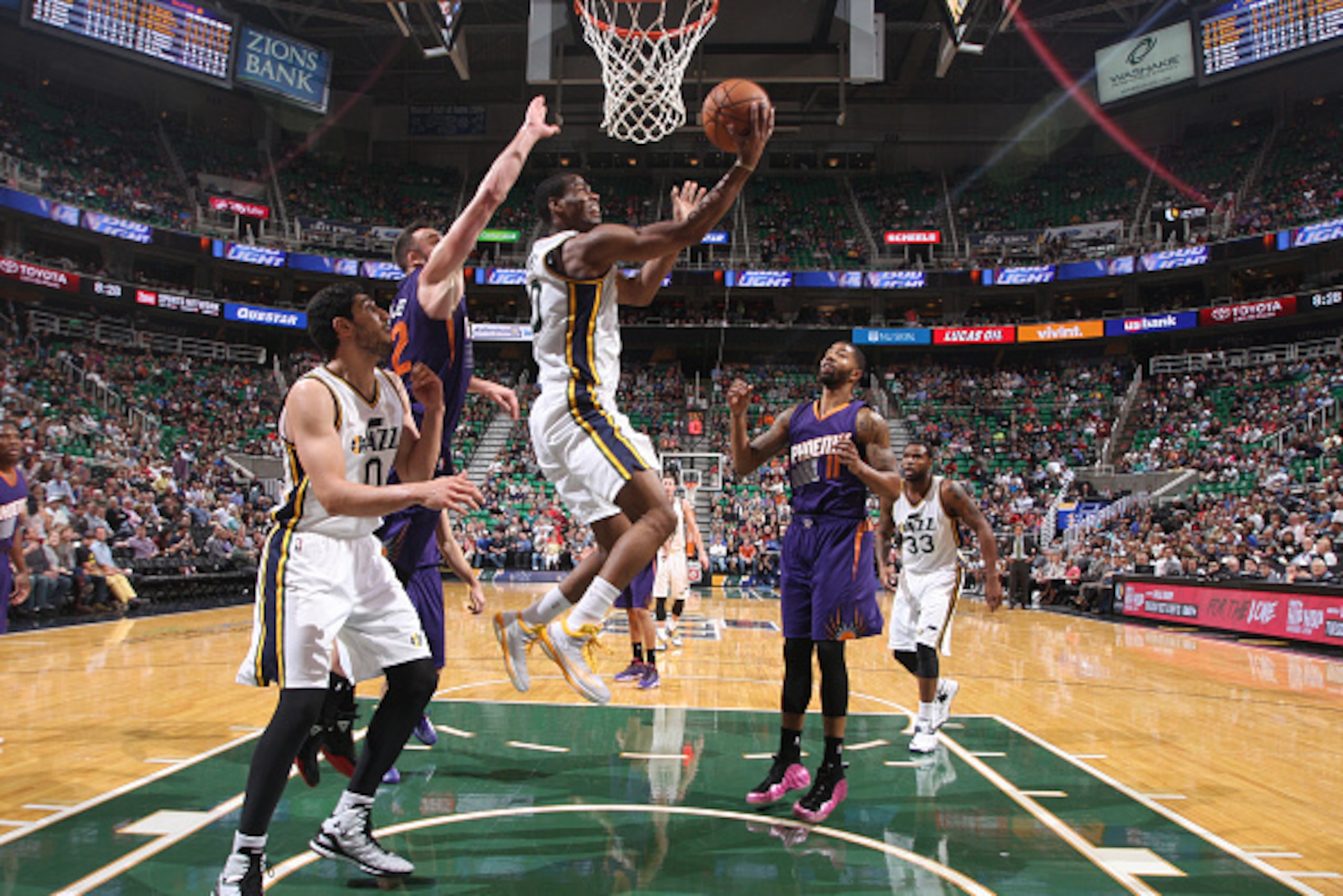 SALT LAKE CITY, UT - OCTOBER 24: Alec Burks #10 of the Utah Jazz goes for a shot against the Phoenix Suns at EnergySolutions Arena on October 24, 2014 in Salt Lake City, Utah. NOTE TO USER: User expressly acknowledges and agrees that, by downloading and o
