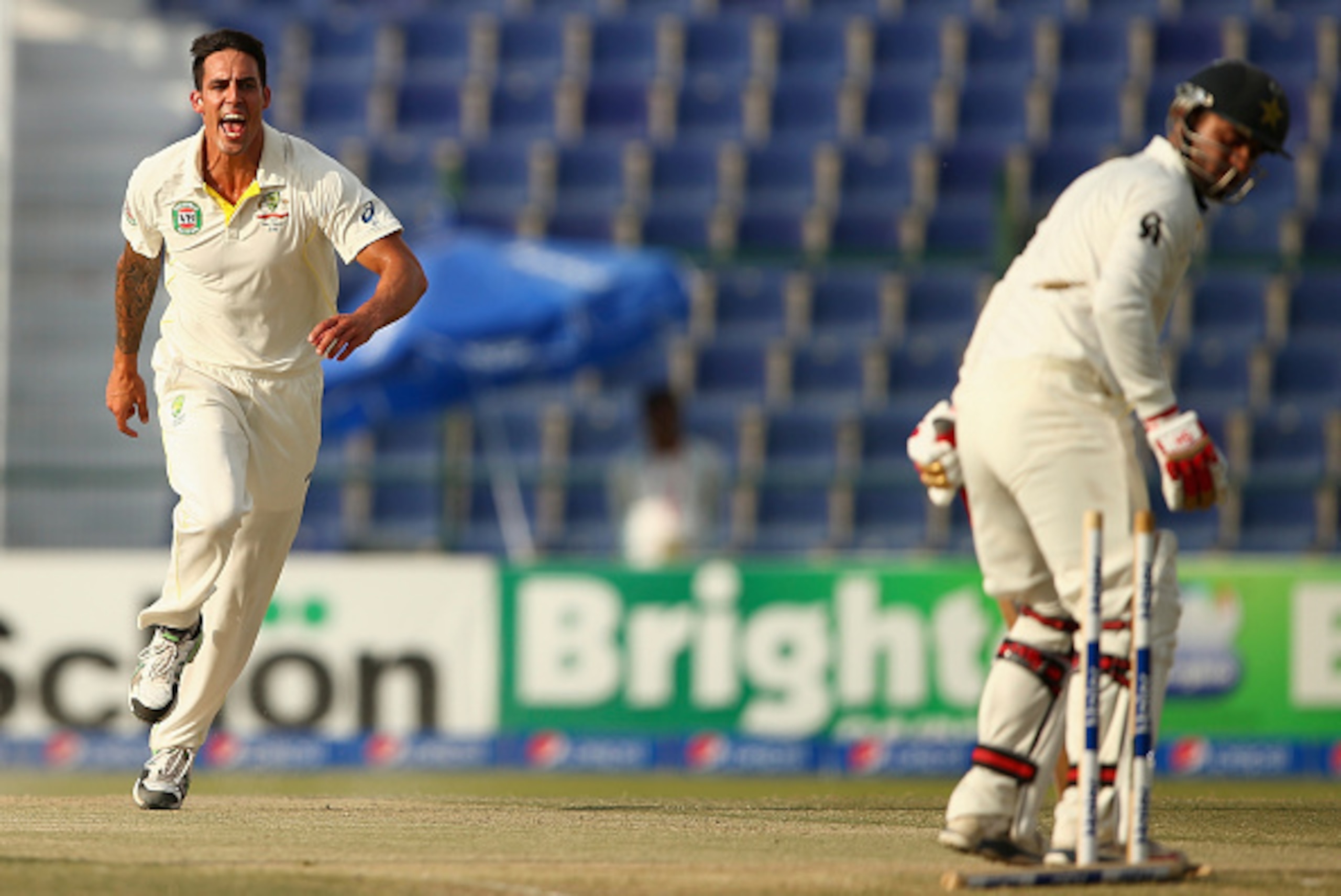 ABU DHABI, UNITED ARAB EMIRATES - NOVEMBER 01:  Mitchell Johnson of Australia celebrates after taking the wicket of Ahmed Shehzad of Pakistan during Day Two of the Second Test between Pakistan and Australia at Sheikh Zayed Stadium on November 1, 2014 in A
