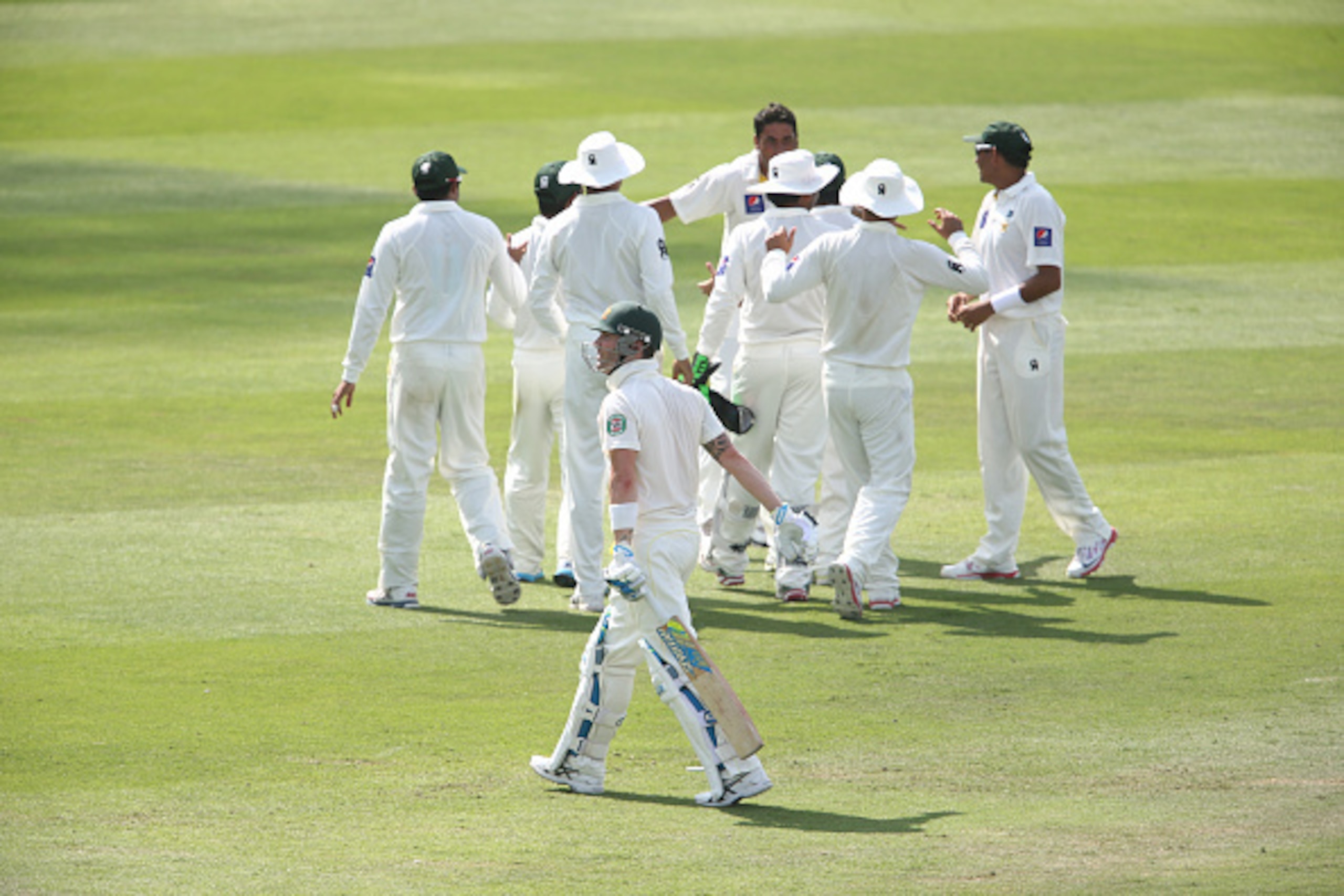 ABU DHABI, UNITED ARAB EMIRATES - NOVEMBER 01:  Michael Clarke of Australia leaves the ground bowled by Imran Khan of Paksitan during Day Three of the Second Test between Pakistan and Australia at Sheikh Zayed Stadium on November 1, 2014 in Abu Dhabi, Uni