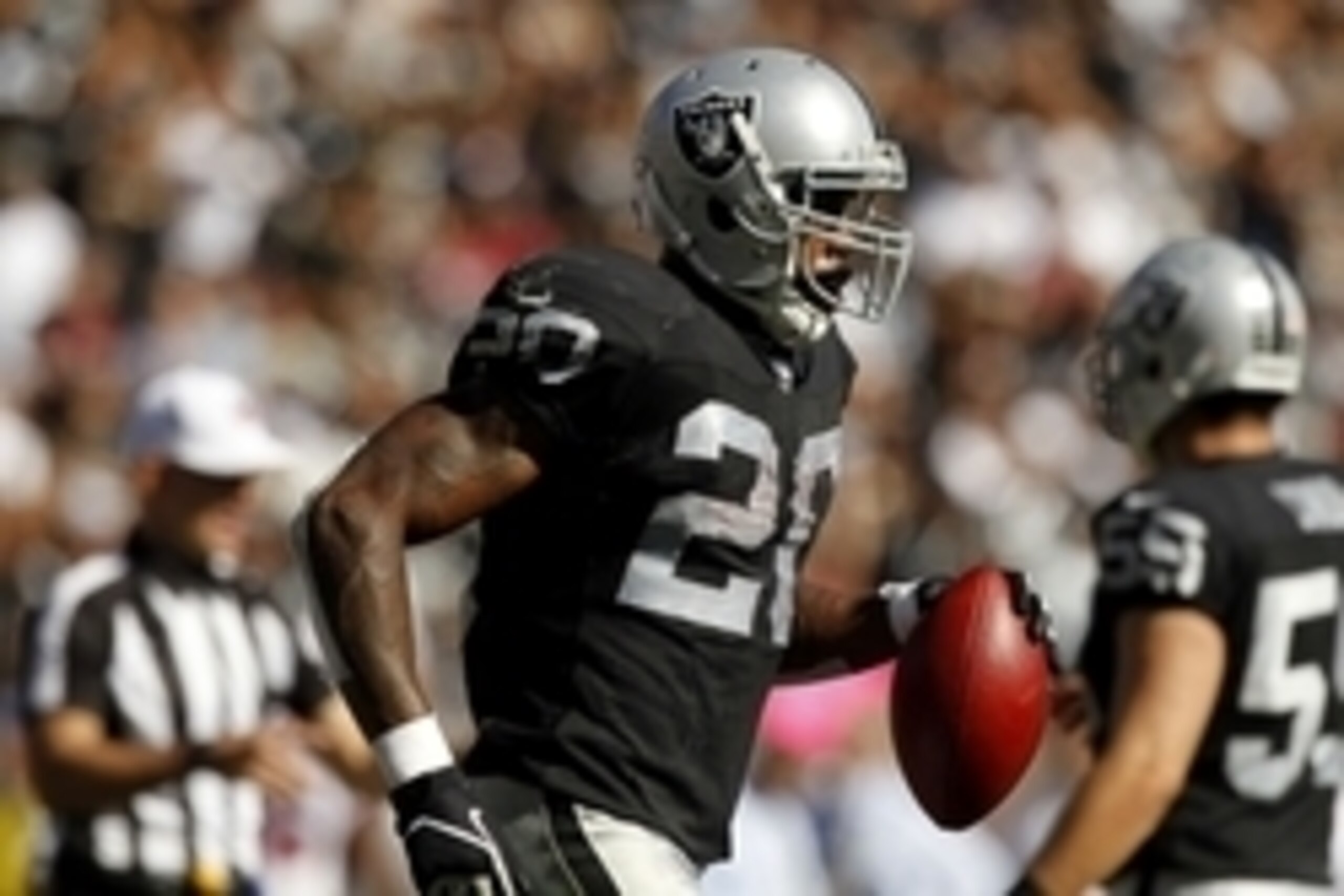 Oct 19, 2014; Oakland, CA, USA; Oakland Raiders running back Darren McFadden (20) jogs towards the sideline after rushing for a touchdown against the Arizona Cardinals in the second quarter at O.co Coliseum. Mandatory Credit: Cary Edmondson-USA TODAY Spor
