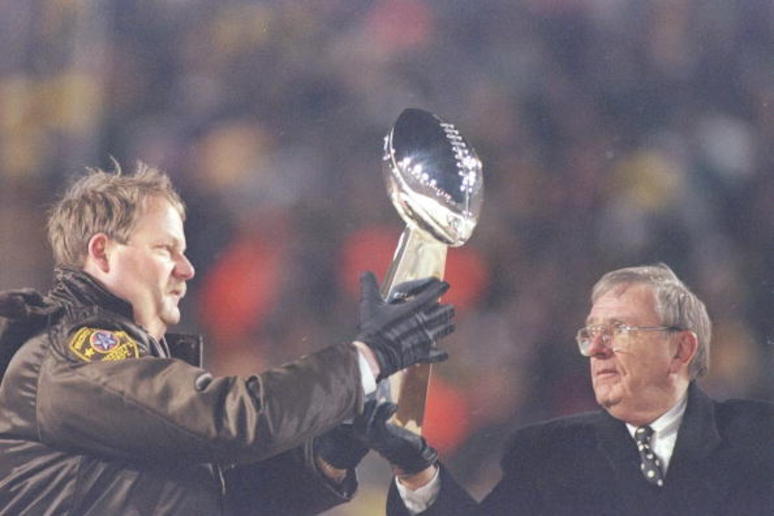 27 Jan 1997:  Green Bay Packers Coach Mike Holmgren (left) and General Manager Ron Wolf hold the trophy during the celebration at Lambeau Field in Green Bay, Wisconsin. Mandatory Credit: Matthew Stockman  /Allsport