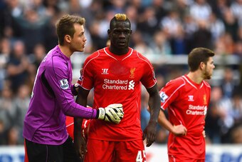 NEWCASTLE UPON TYNE, ENGLAND - NOVEMBER 01: Simon Mignolet of Liverpool has words with Mario Balotelli of Liverpool  during the Barclays Premier League match between Newcastle United and Liverpool at St James' Park on November 1, 2014 in Newcastle upon Ty