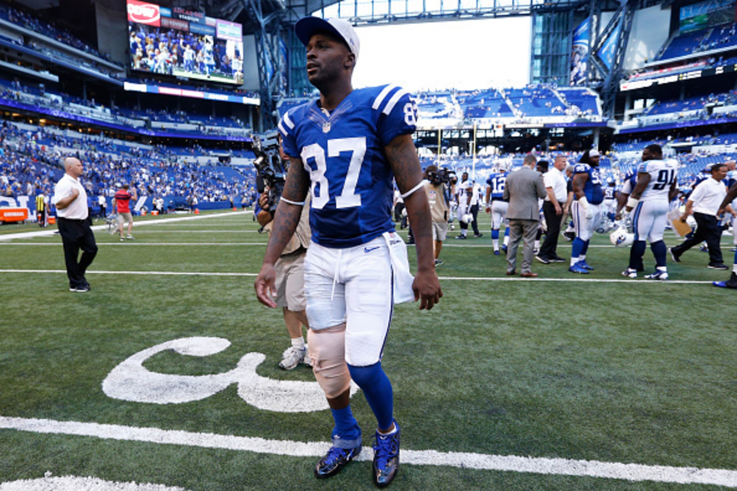 INDIANAPOLIS, IN - SEPTEMBER 28: Reggie Wayne #87 of the Indianapolis Colts walks off the field after the game against the Tennessee Titans at Lucas Oil Stadium on September 28, 2014 in Indianapolis, Indiana. The Colts defeated the Titans 41-17. (Photo by INDIANAPOLIS, IN - SEPTEMBER 28: Reggie Wayne #87 of the Indianapolis Colts walks off the field after the game against the Tennessee Titans at Lucas Oil Stadium on September 28, 2014 in Indianapolis, Indiana. The Colts defeated the Titans 41-17. (Photo by