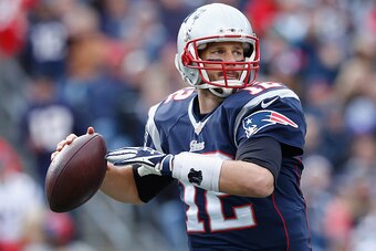 FOXBORO, MA - OCTOBER 26:  Tom Brady #12 of the New England Patriots passes the ball during the second quarter against the Chicago Bears at Gillette Stadium on October 26, 2014 in Foxboro, Massachusetts.  (Photo by Jim Rogash/Getty Images)