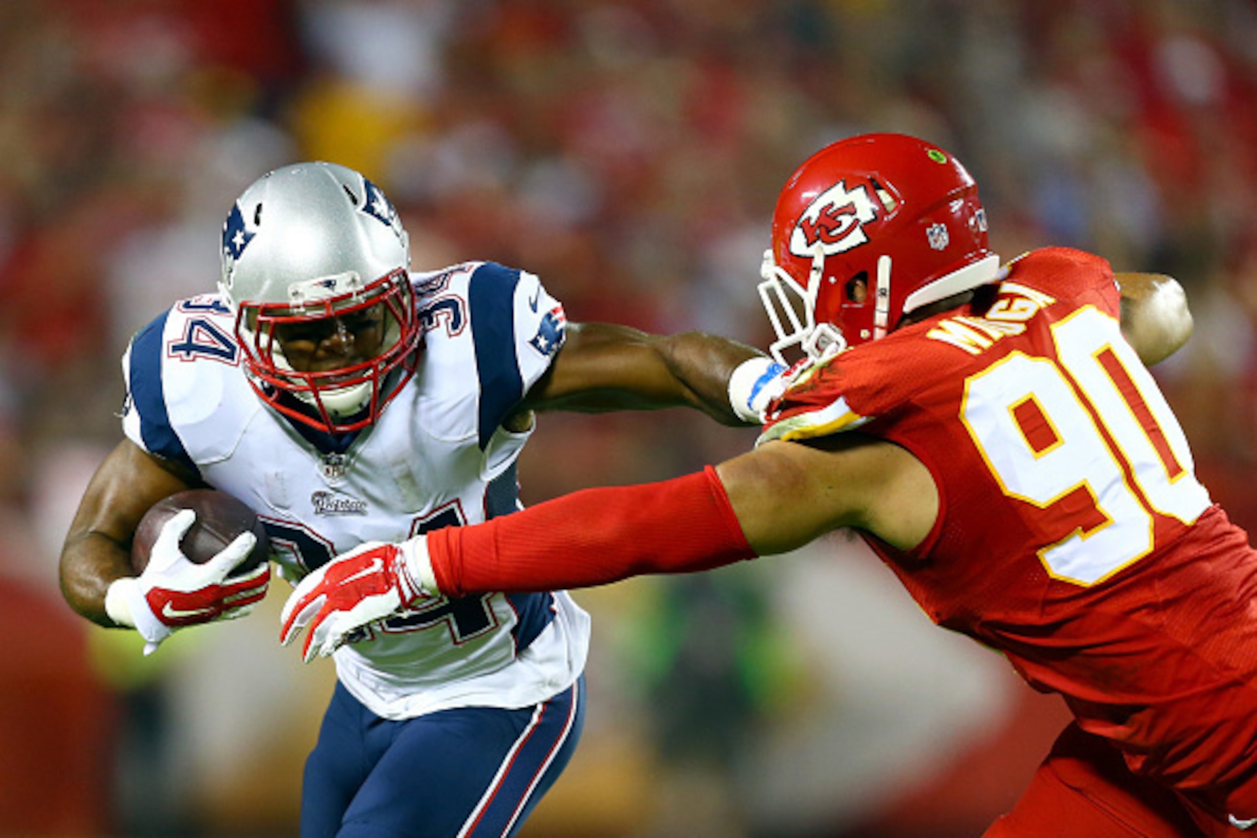 KANSAS CITY, MO - SEPTEMBER 29:   Shane Vereen #34 of the New England Patriots runs the ball against  Josh Mauga #90 of the Kansas City Chiefs during the first half at Arrowhead Stadium on September 29, 2014 in Kansas City, Missouri.  (Photo by Dilip Vish