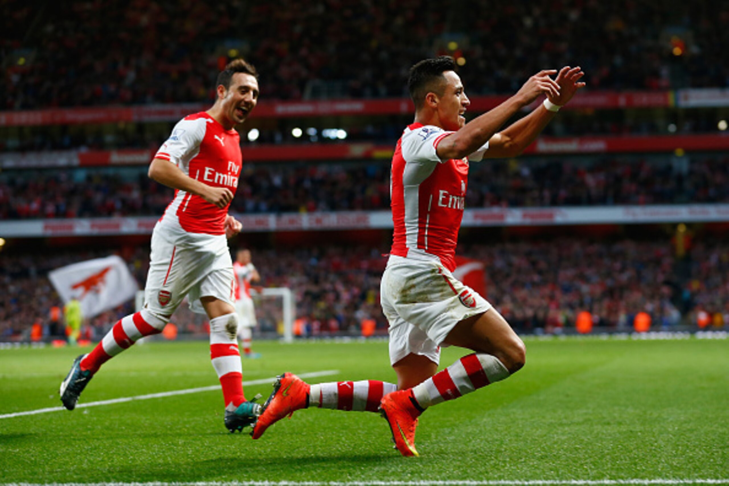 LONDON, ENGLAND - NOVEMBER 01:  Alexis Sanchez of Arsenal celebrates scoring the first goal for Arsenal  during the Barclays Premier League match between Arsenal and Burnley at Emirates Stadium on November 1, 2014 in London, England.  (Photo by Julian Fin