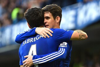 LONDON, ENGLAND - NOVEMBER 01:  Oscar of Chelsea celebrates his goal with Cesc Fabregas during the Barclays Premier League match between Chelsea and Queens Park Rangers at Stamford Bridge on November 1, 2014 in London, England.  (Photo by Mike Hewitt/Gett