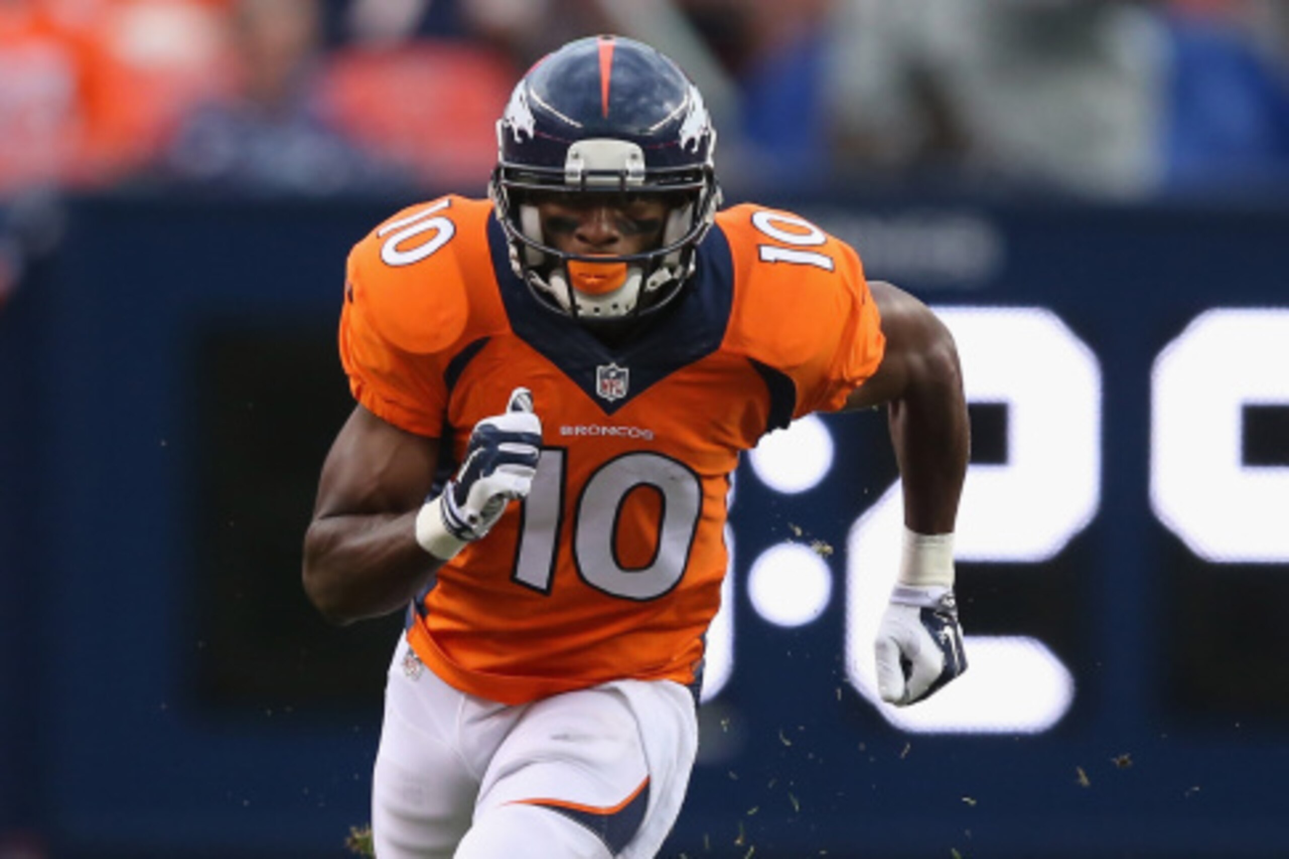 DENVER, CO - AUGUST 07:  Wide receiver Emmanuel Sanders #10 of the Denver Broncos leaves the line of scrimmage against the Seattle Seahawks during preseason action at Sports Authority Field at Mile High on August 7, 2014 in Denver, Colorado. The Broncos d