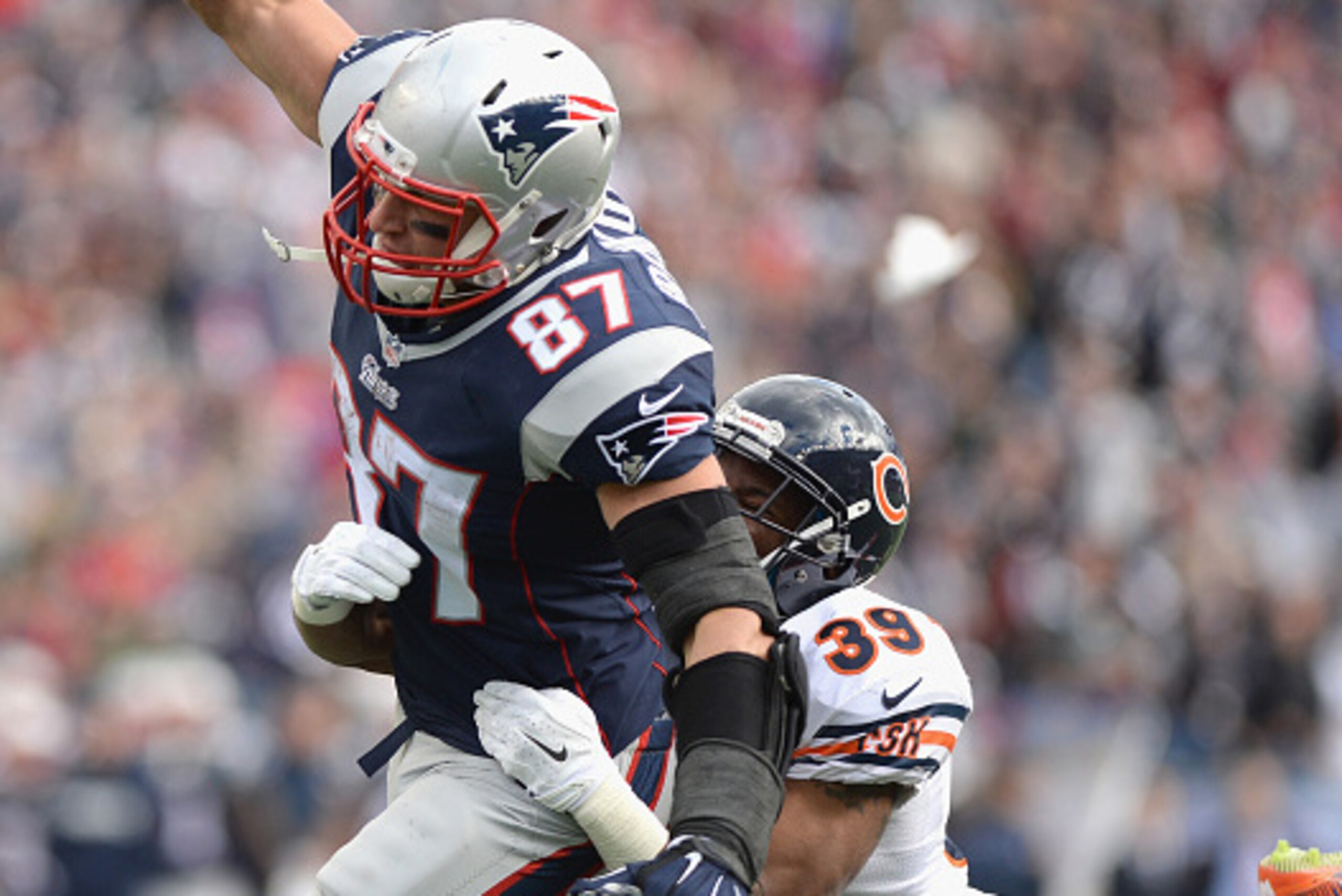 FOXBORO, MA - OCTOBER 26:  Rob Gronkowski #87 of the New England Patriots carries the ball during the third quarter against the Chicago Bears at Gillette Stadium on October 26, 2014 in Foxboro, Massachusetts.  (Photo by Darren McCollester/Getty Images)