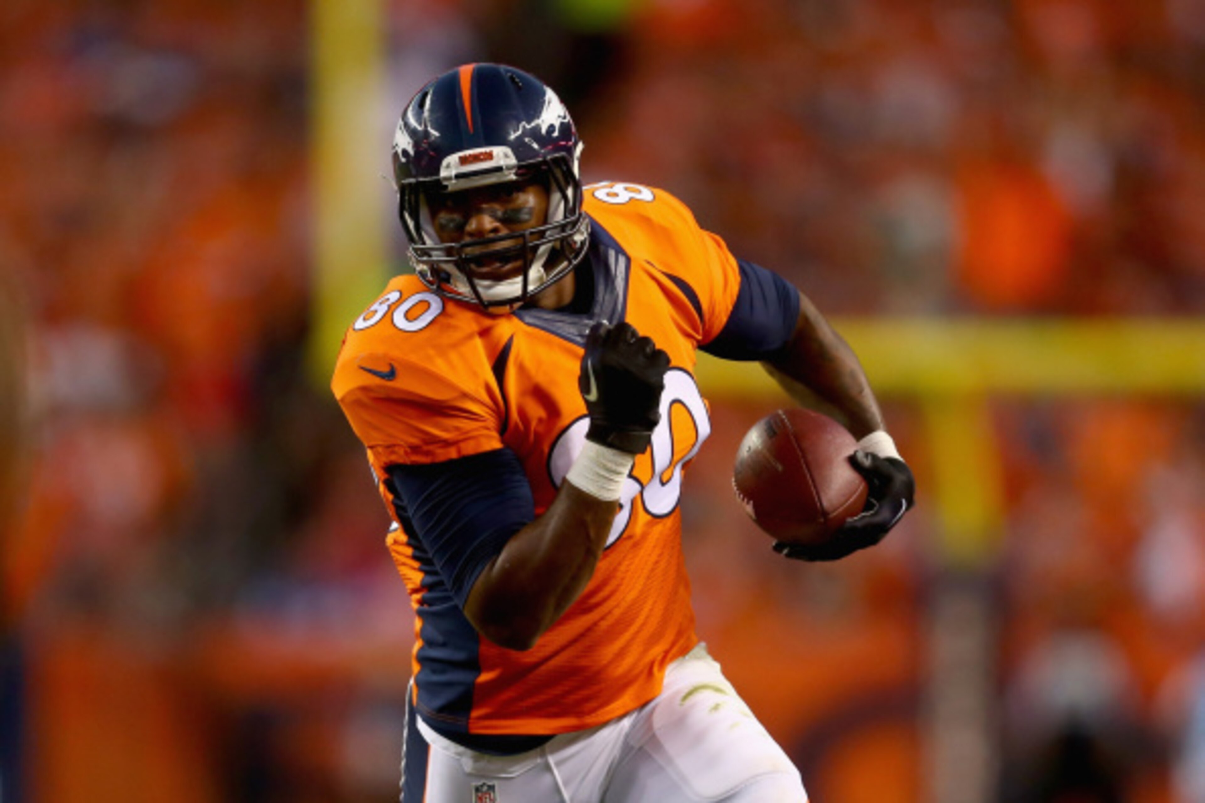 DENVER, CO - SEPTEMBER 07:  Tight end Julius Thomas #80 of the Denver Broncos carries the ball against the Indianapolis Colts at Sports Authority Field at Mile High on September 7, 2014 in Denver, Colorado.  (Photo by Jeff Gross/Getty Images)