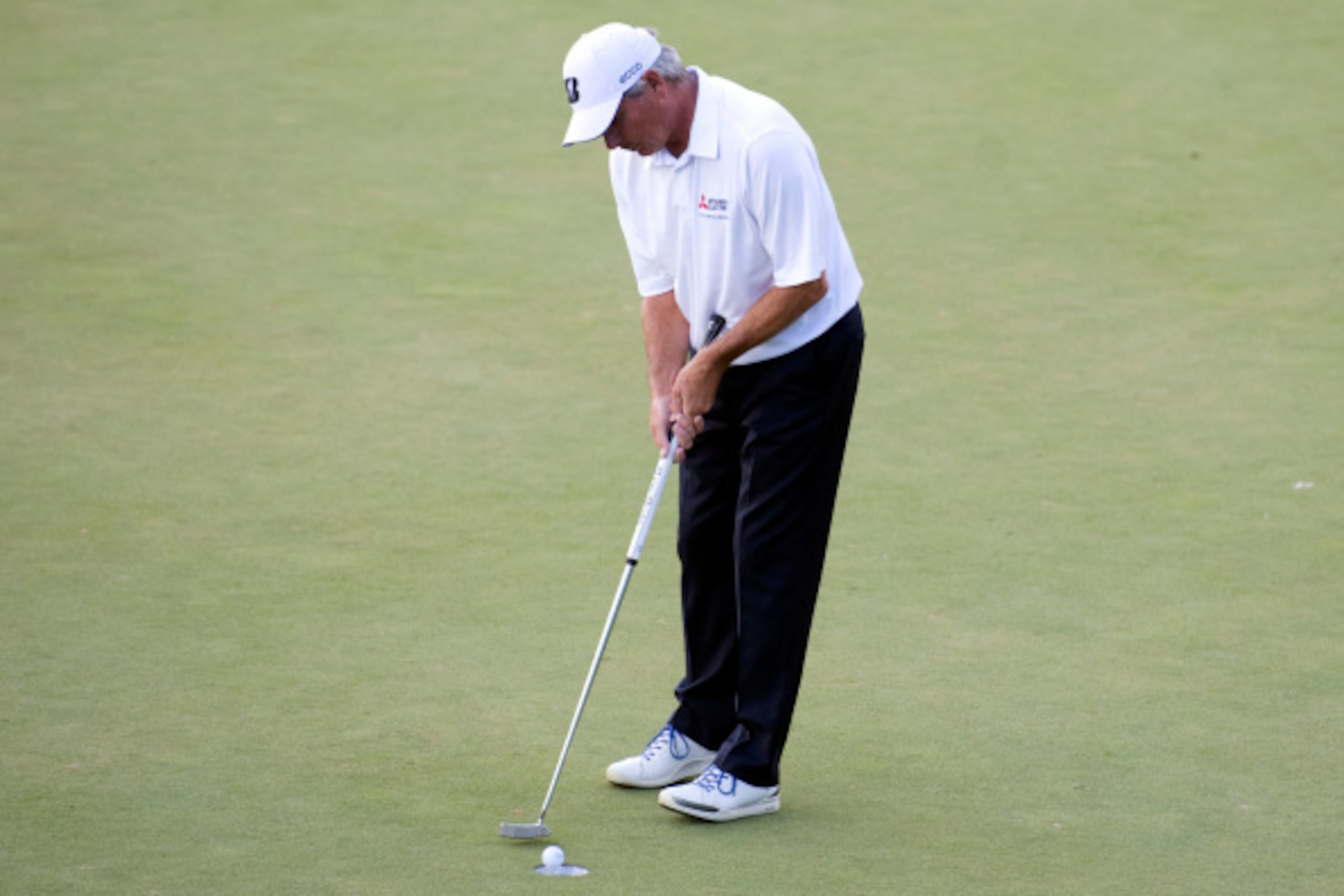 CALGARY, AB. - AUGUST 31: Fred Couples taps in his birdie putt on the 18th green to win his playoff with Billy Andrade after the final round of the Shaw Charity Classic at the Canyon Meadows Golf & Country Club  on August 31, 2014 in Calgary, Canada. (Pho