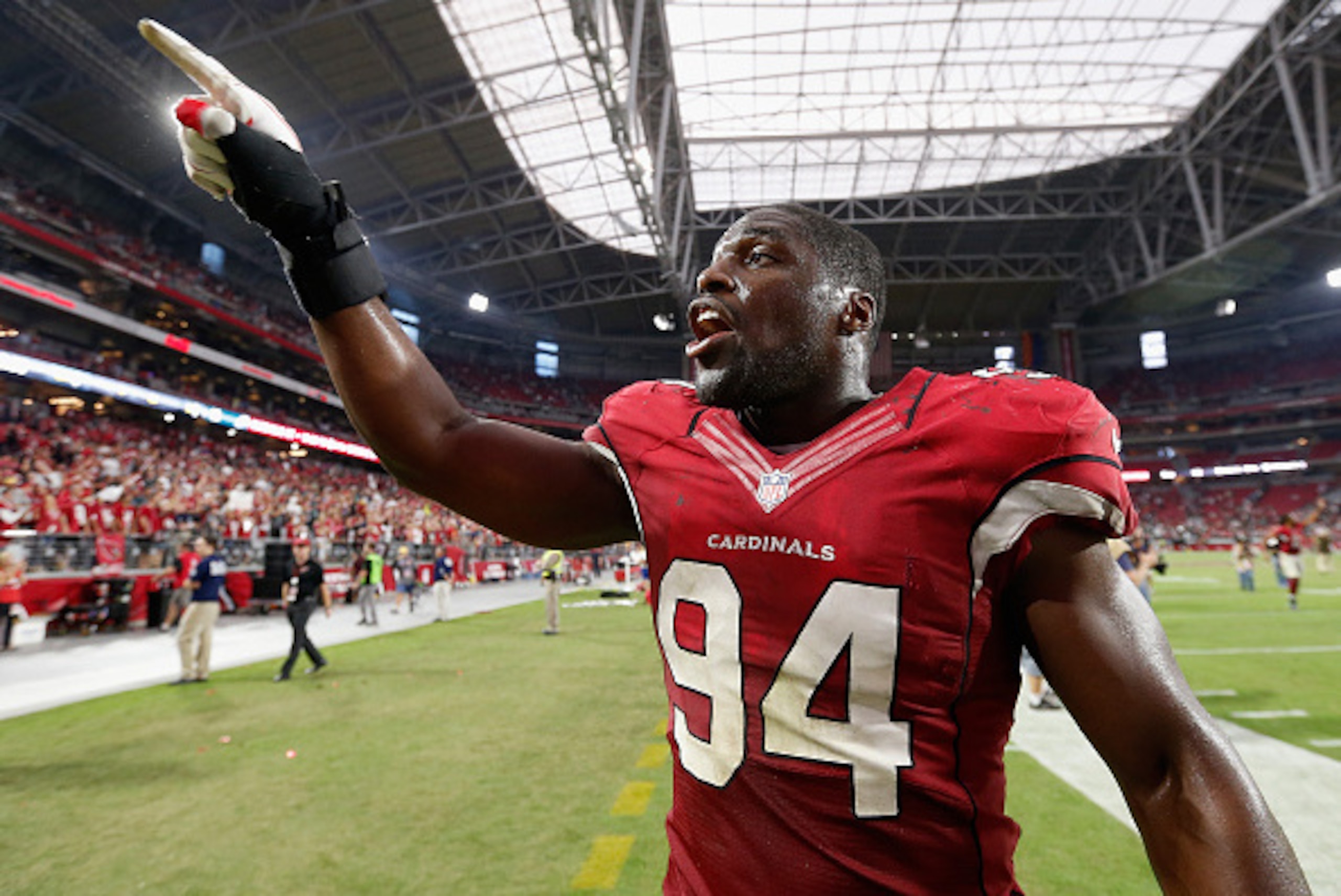 GLENDALE, AZ - OCTOBER 26:  Outside linebacker Sam Acho #94 of the Arizona Cardinals runs off the field following the NFL game against the Philadelphia Eagles at the University of Phoenix Stadium on October 26, 2014 in Glendale, Arizona. The Cardinals def