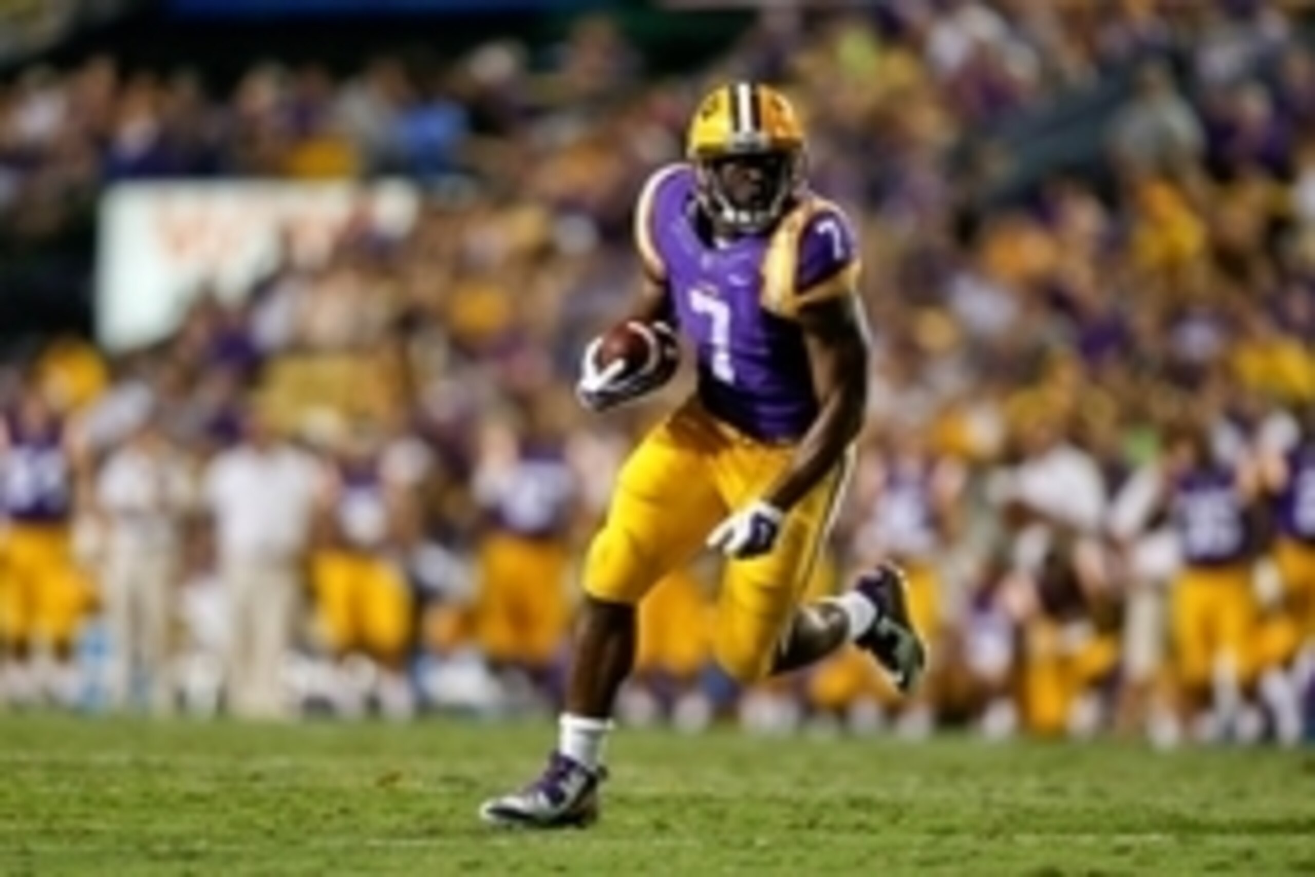 Sep 27, 2014; Baton Rouge, LA, USA; LSU Tigers running back Leonard Fournette (7) breaks loose for a touchdown run against the New Mexico State Aggies during the second quarter of a game at Tiger Stadium. Mandatory Credit: Derick E. Hingle-USA TODAY Sport