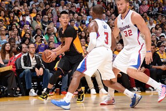 LOS ANGELES, CA - OCTOBER 31:  Jeremy Lin #17 of the Los Angeles Lakers handles the ball against the Los Angeles Clippers on October 31, 2014 at Staples Center in Los Angeles, California. NOTE TO USER: User expressly acknowledges and agrees that, by downl