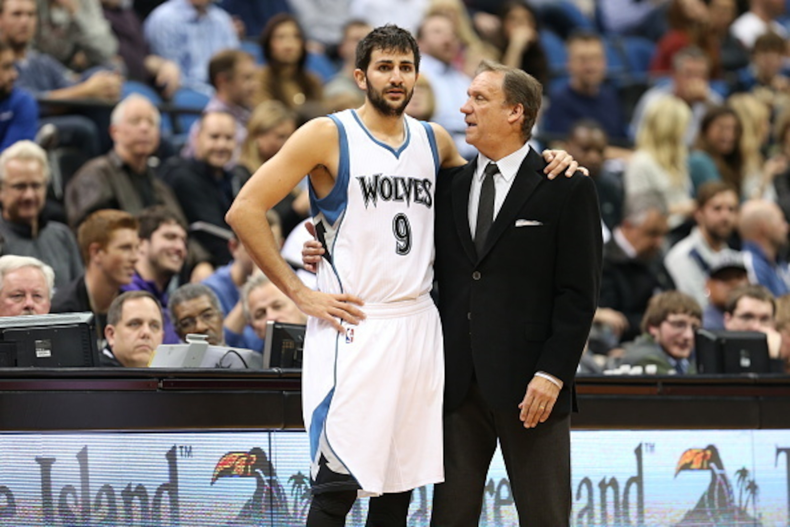 MINNEAPOLIS, MN - OCTOBER 21:  Ricky Rubio #9 of the Minnesota Timberwolves talks with Head Coach Flip Saunders during the game against the Indiana Pacers on October 21, 2014 at Target Center in Minneapolis, Minnesota. NOTE TO USER: User expressly acknowl