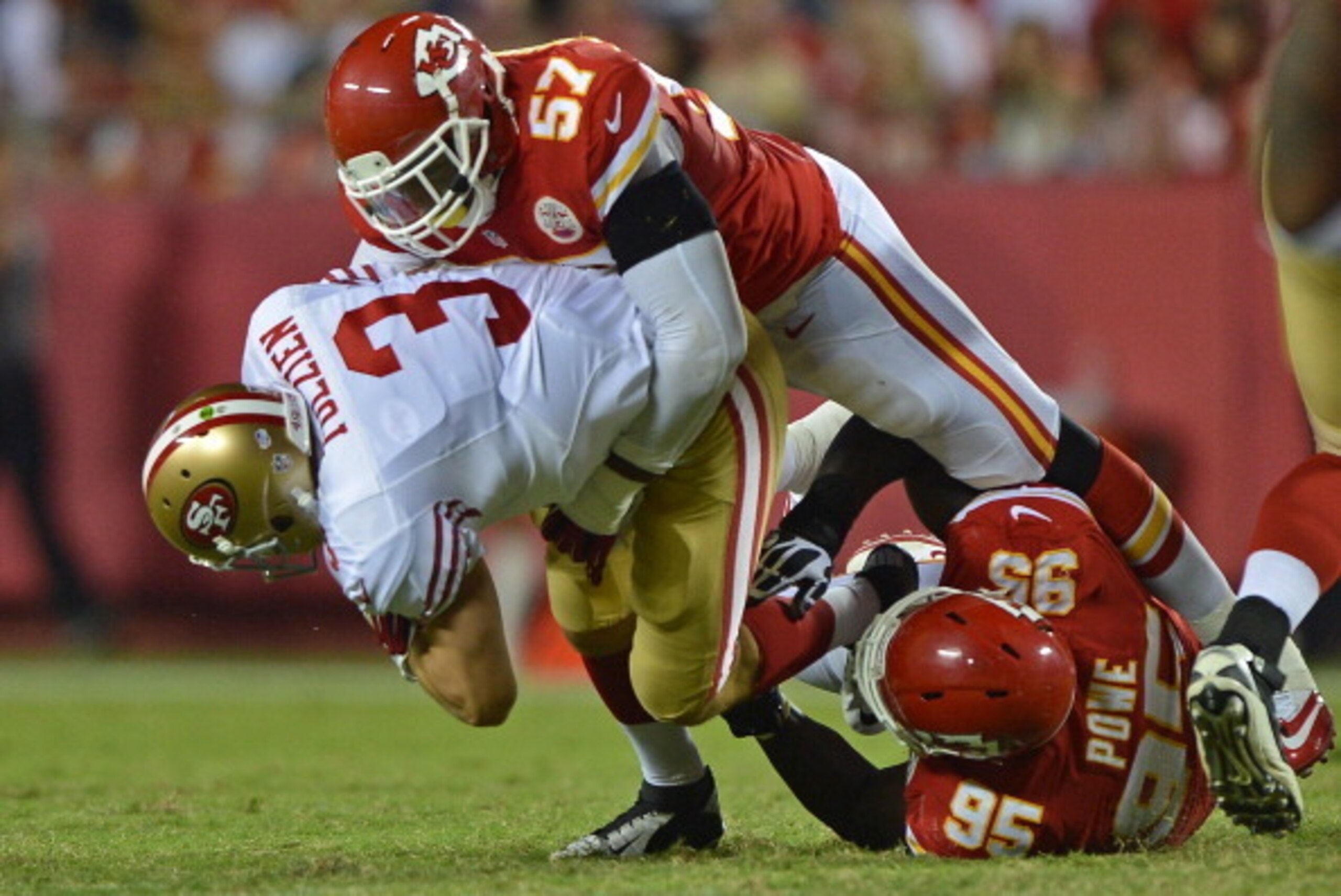 KANSAS CITY, MO - AUGUST 16:  Defenders Nico Johnson #57 and Jerrell Powe #95 of the Kansas City Chiefs sack quarterback Scott Tolzien #3 of the San Francisco 49ers during the second half on August 16, 2013 at Arrowhead Stadium in Kansas City, Missouri.  