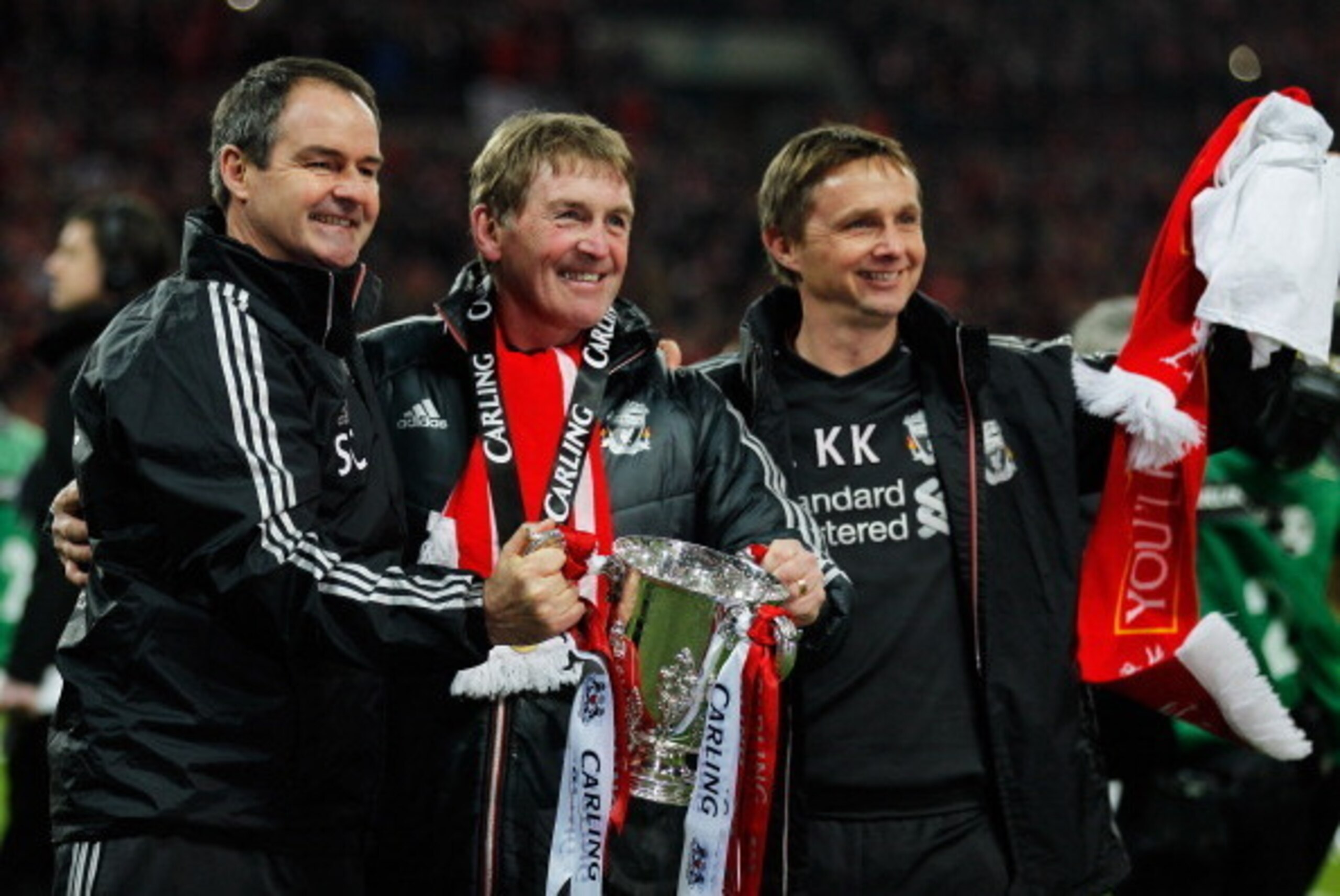LONDON, ENGLAND - FEBRUARY 26:  Kenny Dalglish manager of Liverpool celebrates with Steve Clarke and Kevin Keen after victory in the Carling Cup Final match between Liverpool and Cardiff City at Wembley Stadium on February 26, 2012 in London, England. Liv