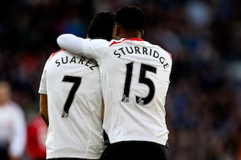 CARDIFF, WALES - MARCH 22:  Daniel Sturridge of Liverpool celebrates with team mate Luis Suarez after scoring his team's fifth goal during the Barclays Premier League match between Cardiff City and Liverpool at Cardiff City Stadium on March 22, 2014 in Ca