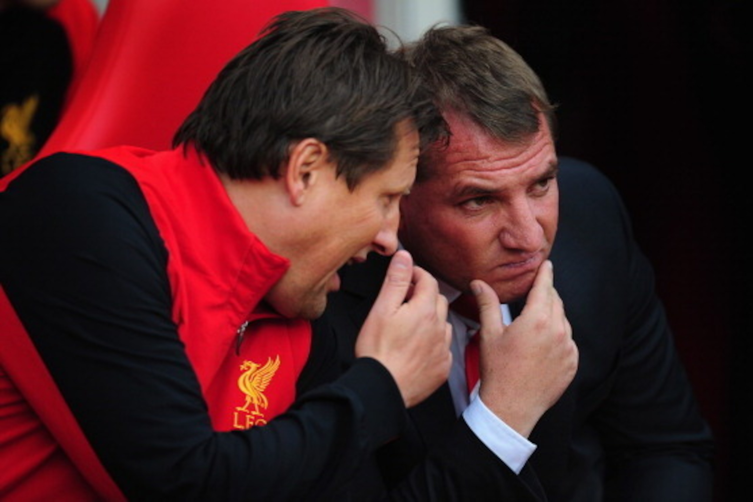SUNDERLAND, ENGLAND - SEPTEMBER 15:  Liverpool manager Brendan Rodgers (r) listens to coach Colin Pascoe before the Barclays Premier league match between Sunderland and Liverpool at Stadium of Light on September 15, 2012 in Sunderland, England.  (Photo by