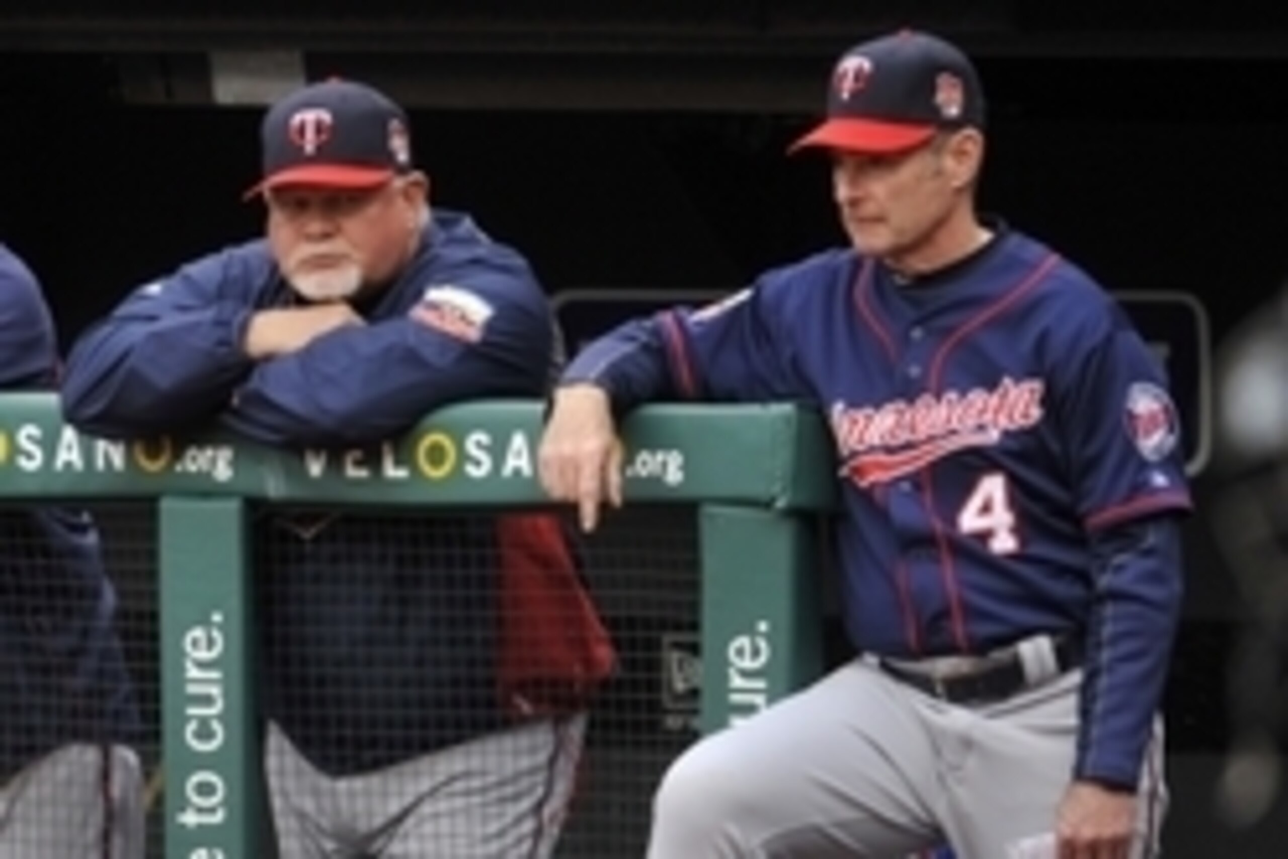 May 7, 2014; Cleveland, OH, USA; Minnesota Twins manager Ron Gardenhire (left) and coach Paul Molitor (4) watch from the dugout in the first inning against the Cleveland Indians at Progressive Field. Mandatory Credit: David Richard-USA TODAY Sports