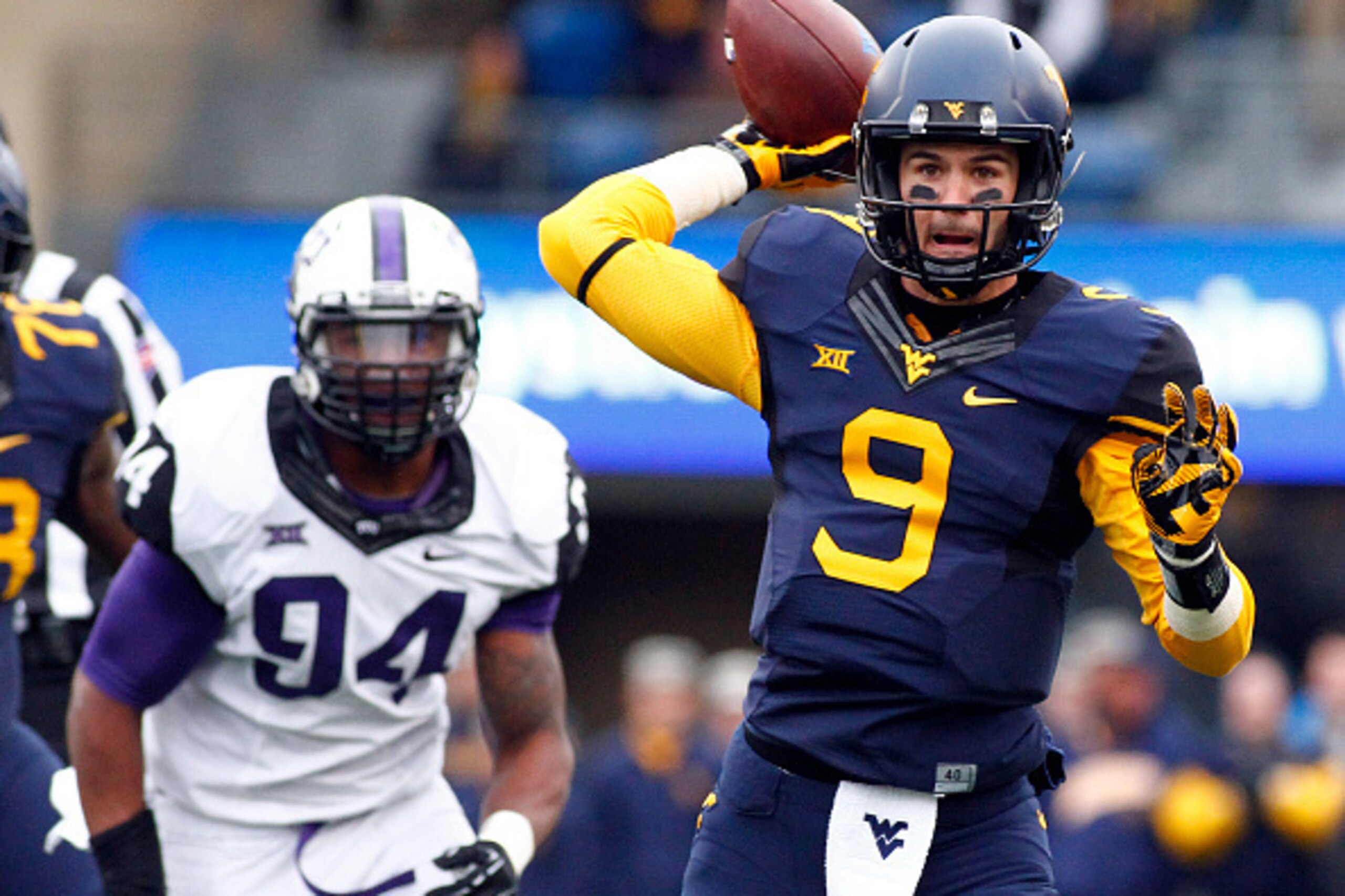 MORGANTOWN, WV - NOVEMBER 01: Clint Trickett #9 of the West Virginia Mountaineers passes on the run in the first quarter against the TCU Horned Frogs during the game on November 1, 2014 at Mountaineer Field in Morgantown, West Virginia. (Photo by Justin MORGANTOWN, WV - NOVEMBER 01: Clint Trickett #9 of the West Virginia Mountaineers passes on the run in the first quarter against the TCU Horned Frogs during the game on November 1, 2014 at Mountaineer Field in Morgantown, West Virginia. (Photo by Justin