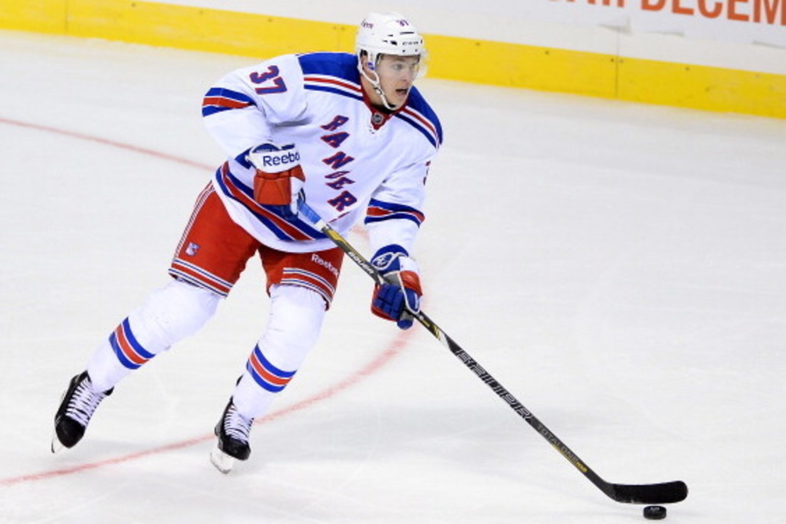 LAS VEGAS, NV - SEPTEMBER 27:  Conor Allen #37 of the New York Rangers skates with the puck against the Los Angeles Kings during their preseason game at the MGM Grand Garden Arena on September 27, 2013 in Las Vegas, Nevada. Los Angeles won 4-1.  (Photo by