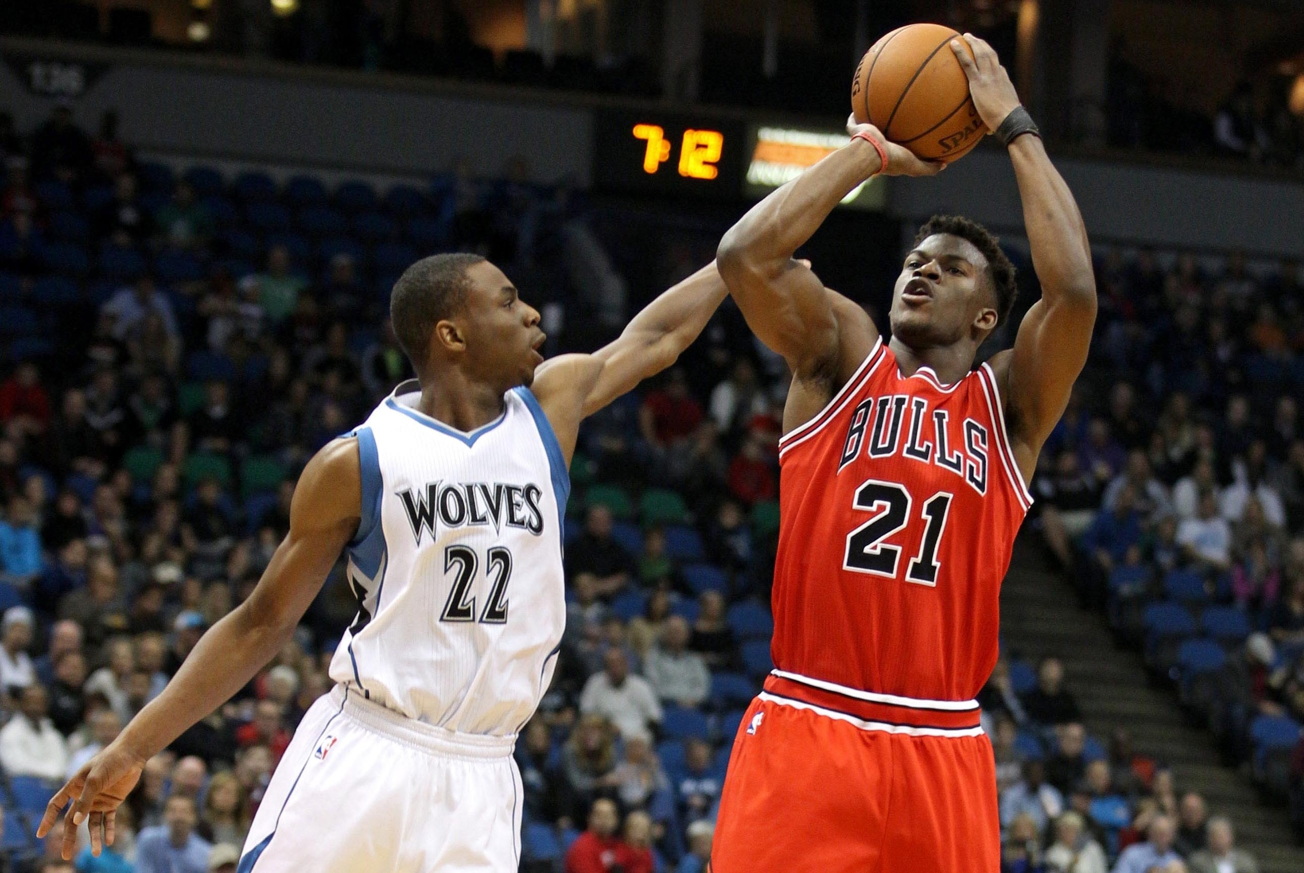 Nov 1, 2014; Minneapolis, MN, USA; Chicago Bulls guard Jimmy Butler (21) shoots over Minnesota Timberwolves guard Andrew Wiggins (22) during the first quarter at Target Center. Mandatory Credit: Brace Hemmelgarn-USA TODAY Sports
