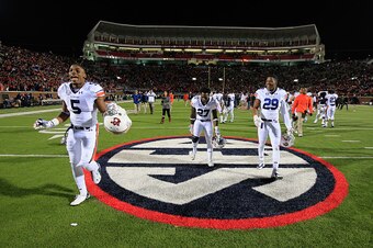 OXFORD, MS - NOVEMBER 01:  Ricardo Louis #5, Robenson Therezie #27 and Brandon King #29 of the Auburn Tigers celebrate on the field after defeating the Mississippi Rebels at Vaught-Hemingway Stadium on November 1, 2014 in Oxford, Mississippi. Auburn defea