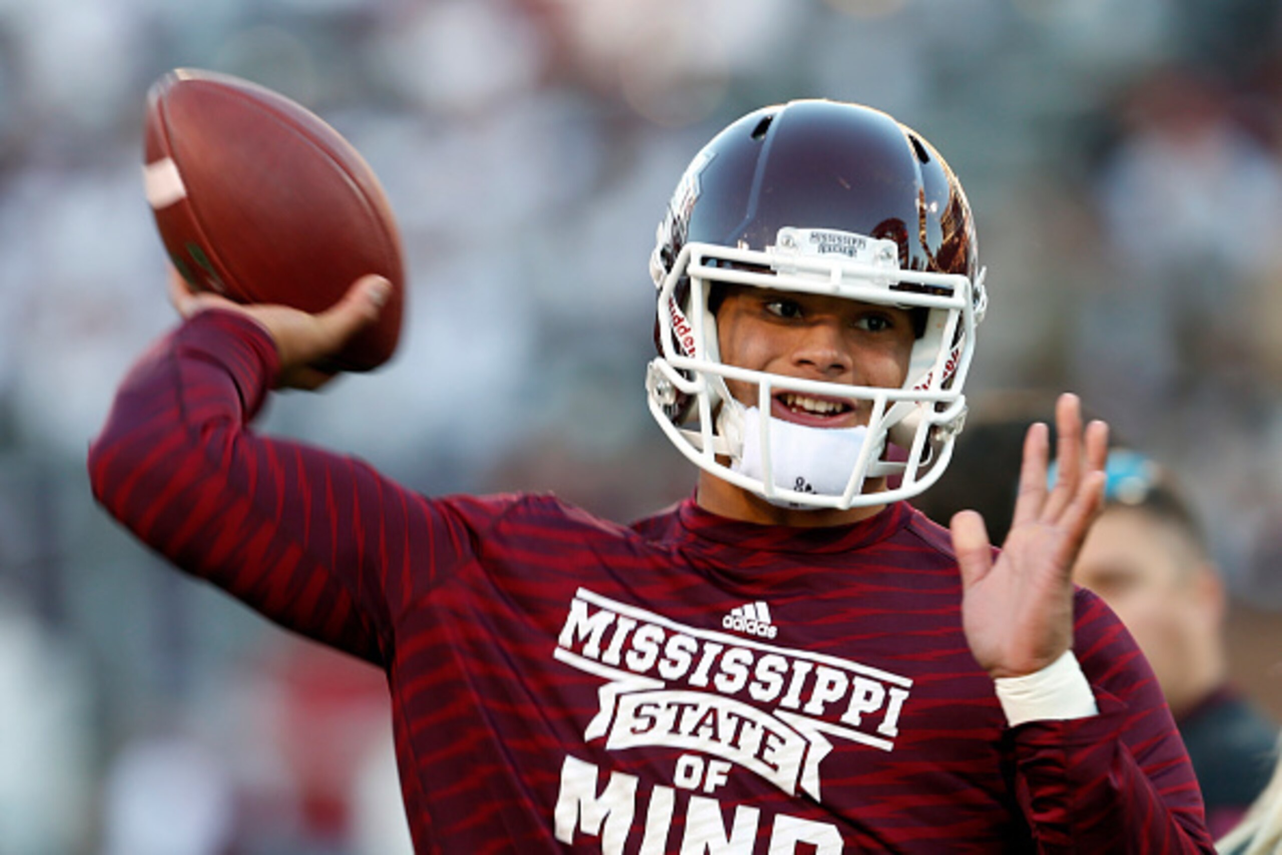 STARKVILLE, MS - NOVEMBER 1:  Dak Prescott, quarterback of the Mississippi State Bulldogs, warms up before the game against Arkansas at Davis Wade Stadium on November 1, 2014, in Starkville, Mississippi. (Photo by Butch Dill/Getty Images)