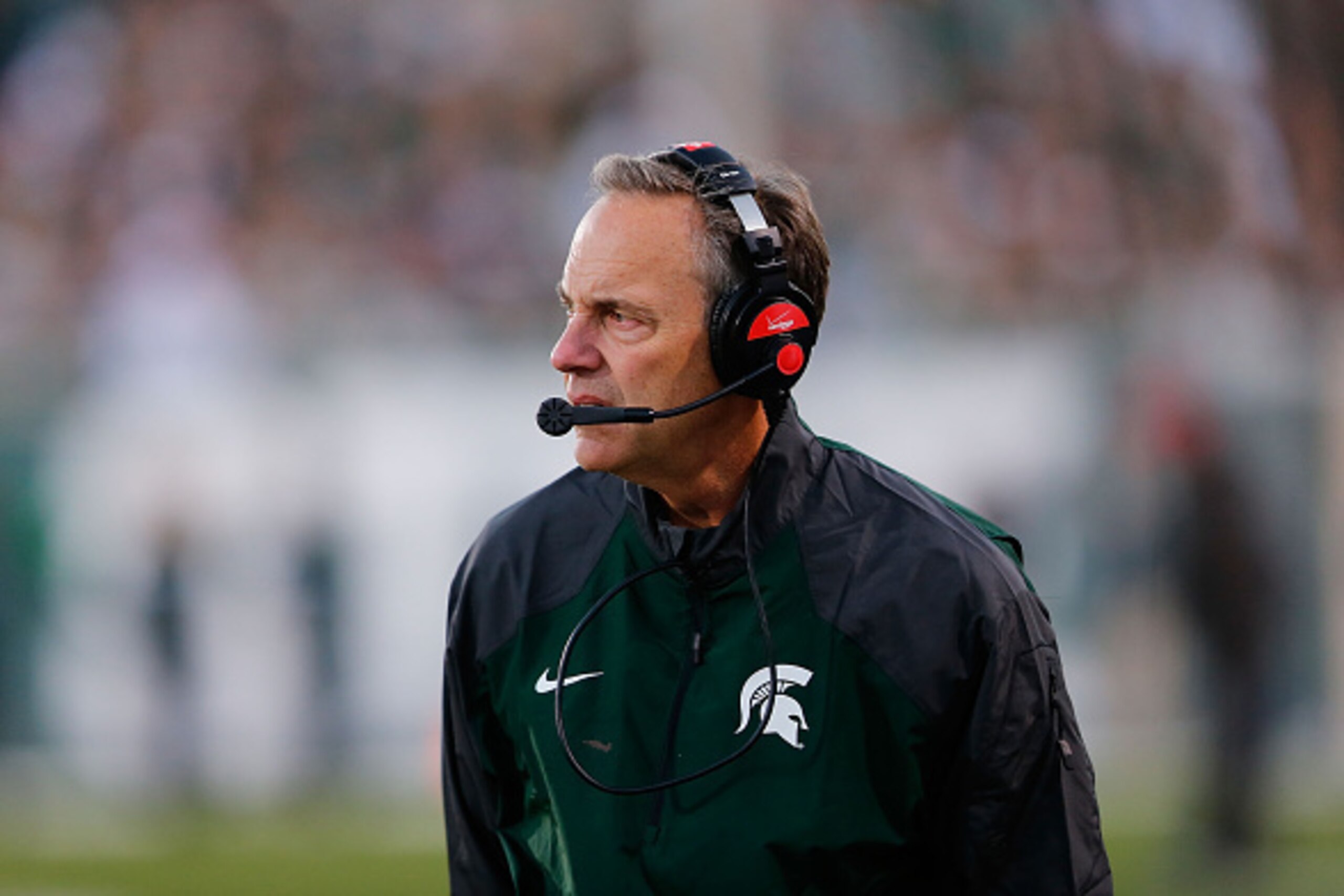 EAST LANSING, MI - OCTOBER 25:  Michigan State head football coach Mark Dantonio watches the action from the sidelines during the fourth quarter of the game against the Michigan Wolverines at Spartan Stadium on October 25, 2014 in East Lansing, Michigan. 