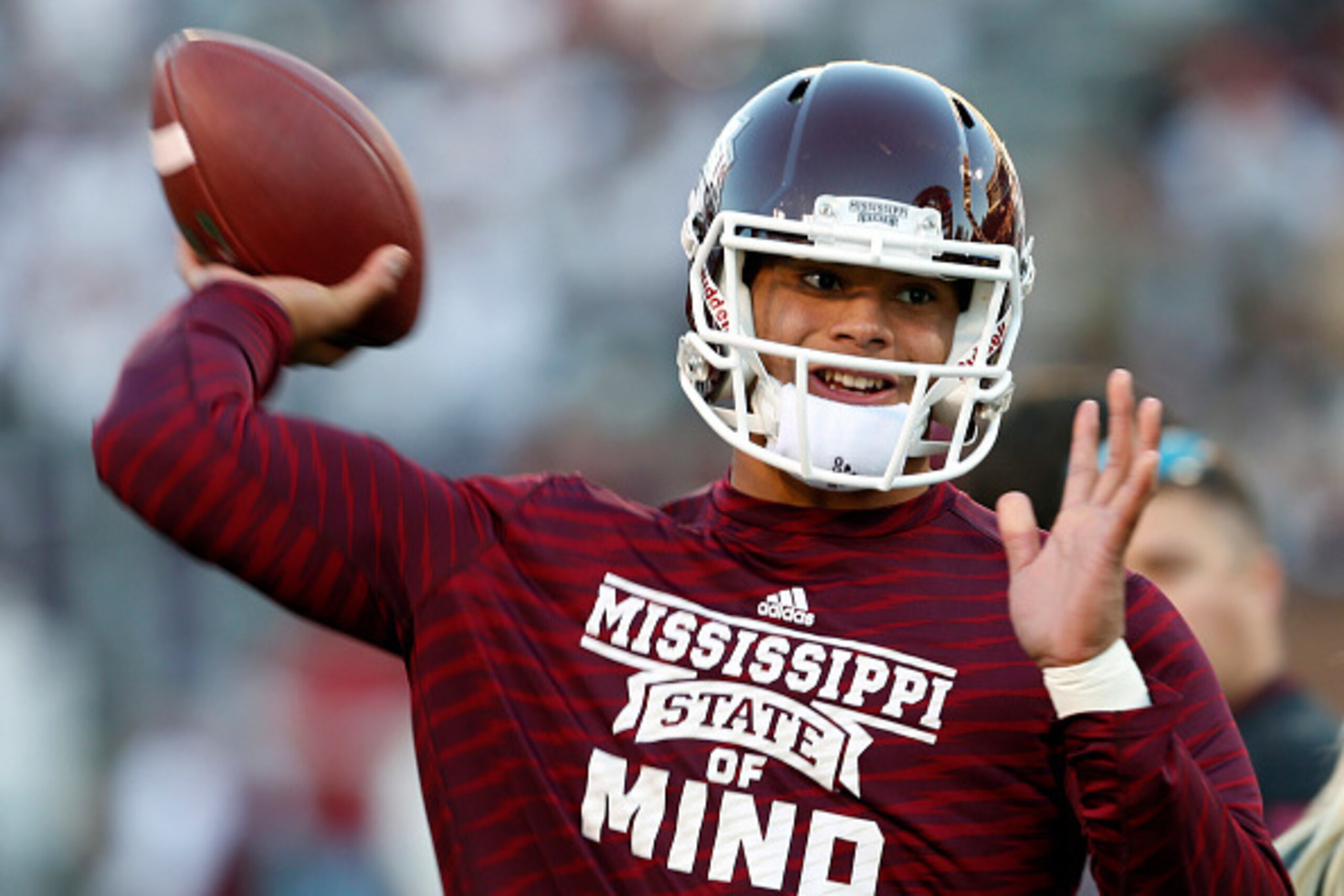 STARKVILLE, MS - NOVEMBER 1:  Dak Prescott, quarterback of the Mississippi State Bulldogs, warms up before the game against Arkansas at Davis Wade Stadium on November 1, 2014, in Starkville, Mississippi. (Photo by Butch Dill/Getty Images)