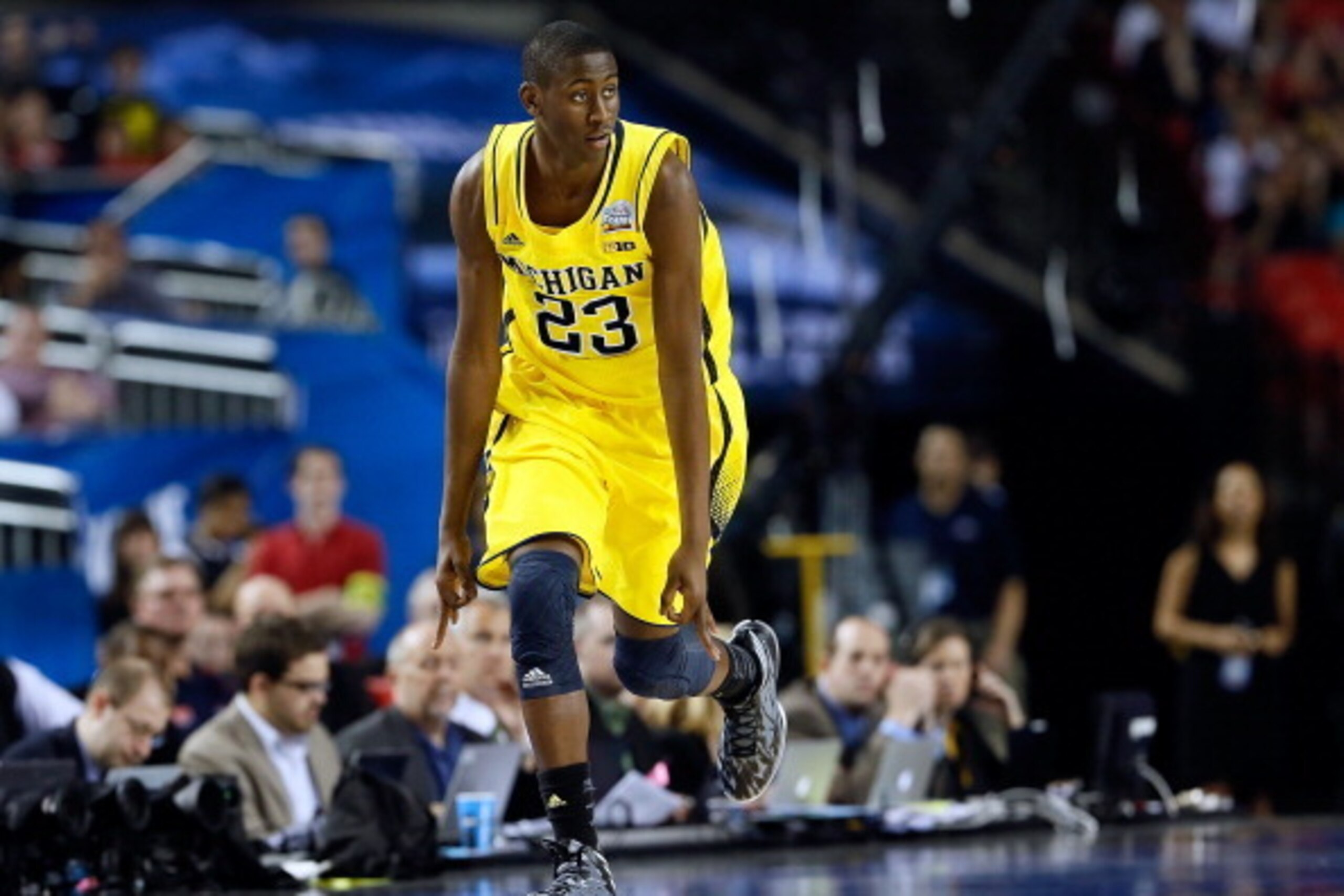 ATLANTA, GA - APRIL 06:  Caris LeVert #23 of the Michigan Wolverines reacts after making a three-pointer in the first half while taking on the Syracuse Orange during the 2013 NCAA Men's Final Four Semifinal at the Georgia Dome on April 6, 2013 in Atlanta,