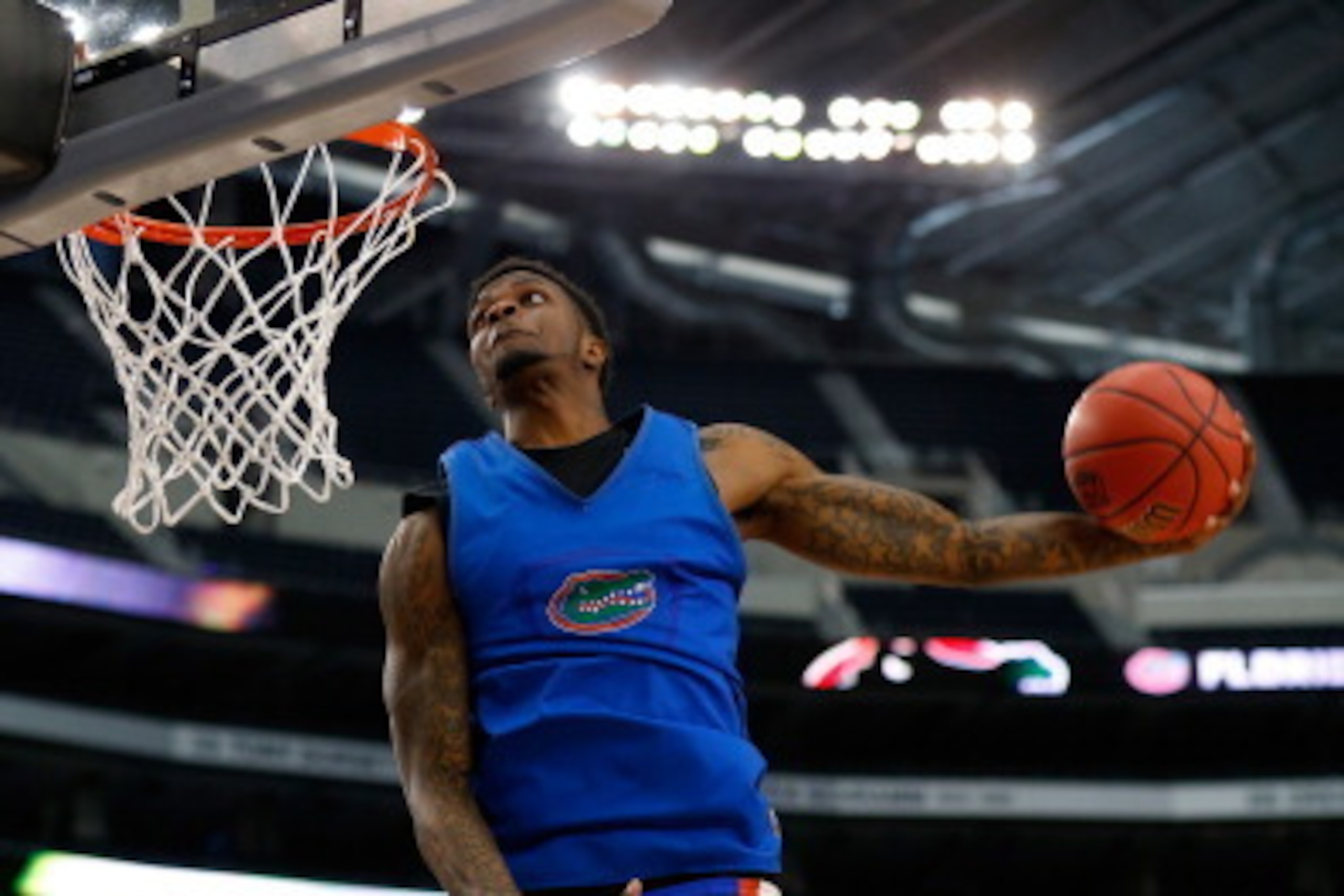 ARLINGTON, TX - APRIL 04:  Chris Walker #23 of the Florida Gators goes up for a dunk as the Gators practice ahead of the 2014 NCAA Men's Final Four at AT&T Stadium on April 4, 2014 in Arlington, Texas.  (Photo by Tom Pennington/Getty Images)