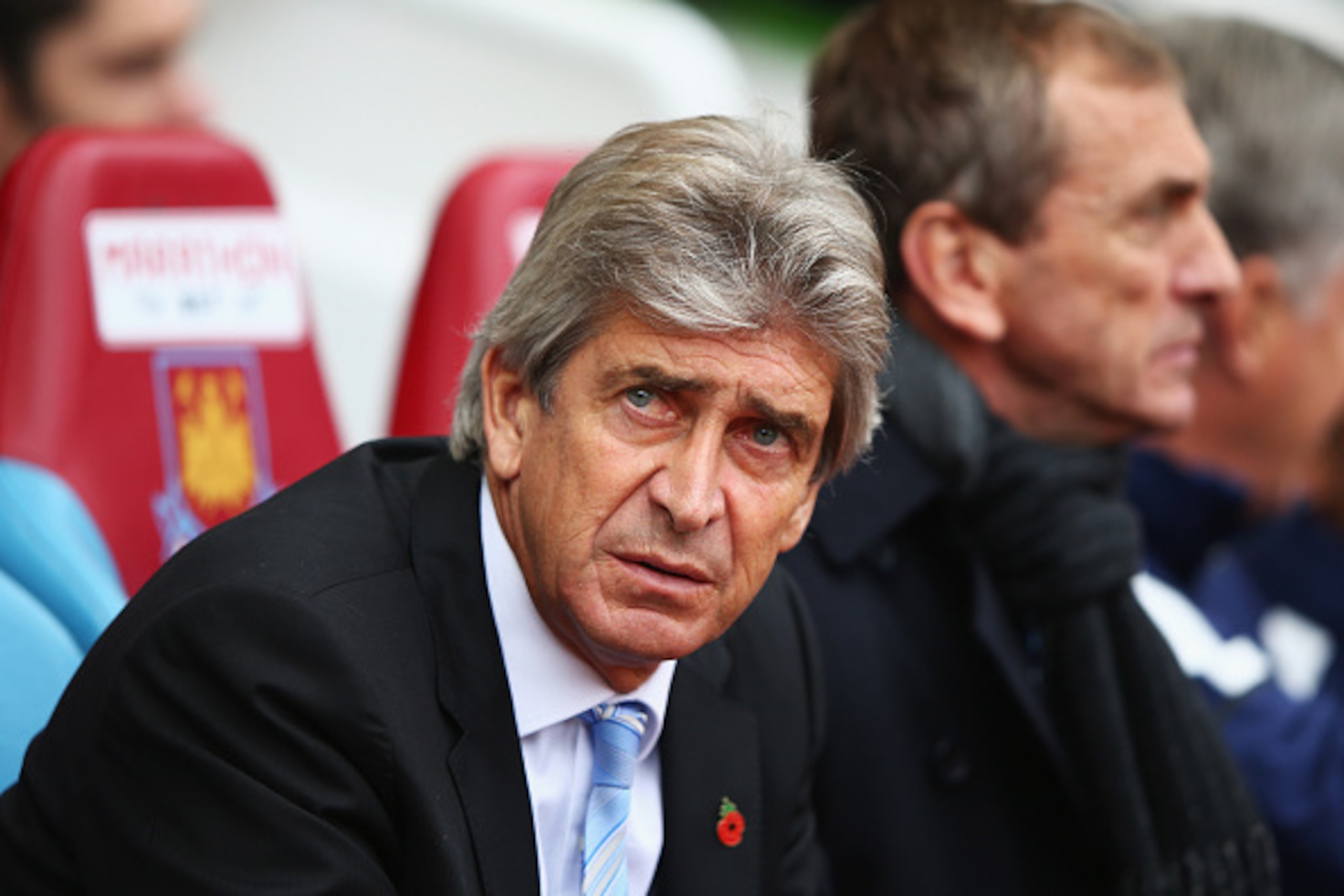 LONDON, ENGLAND - OCTOBER 25:  Manuel Pellegrini, manager of Manchester City looks on with assistant Ruben Cousillas during the Barclays Premier League match between West Ham United and Manchester City at Boleyn Ground on October 25, 2014 in London, Engla