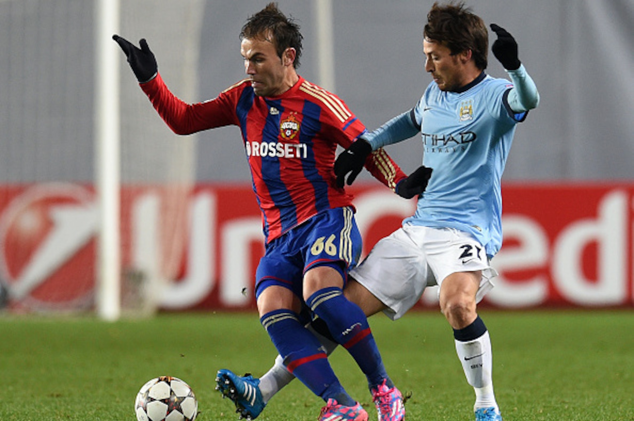 KHIMKI, RUSSIA - OCTOBER 21: Bibras Natkho (L) of PFC CSKA Moscow challenged by David Silva of Manchester City FC during the UEFA Champions League Group E match between PFC CSKA Moscow and Manchester City FC at the Arena Khimki Stadium on October 21, 2014