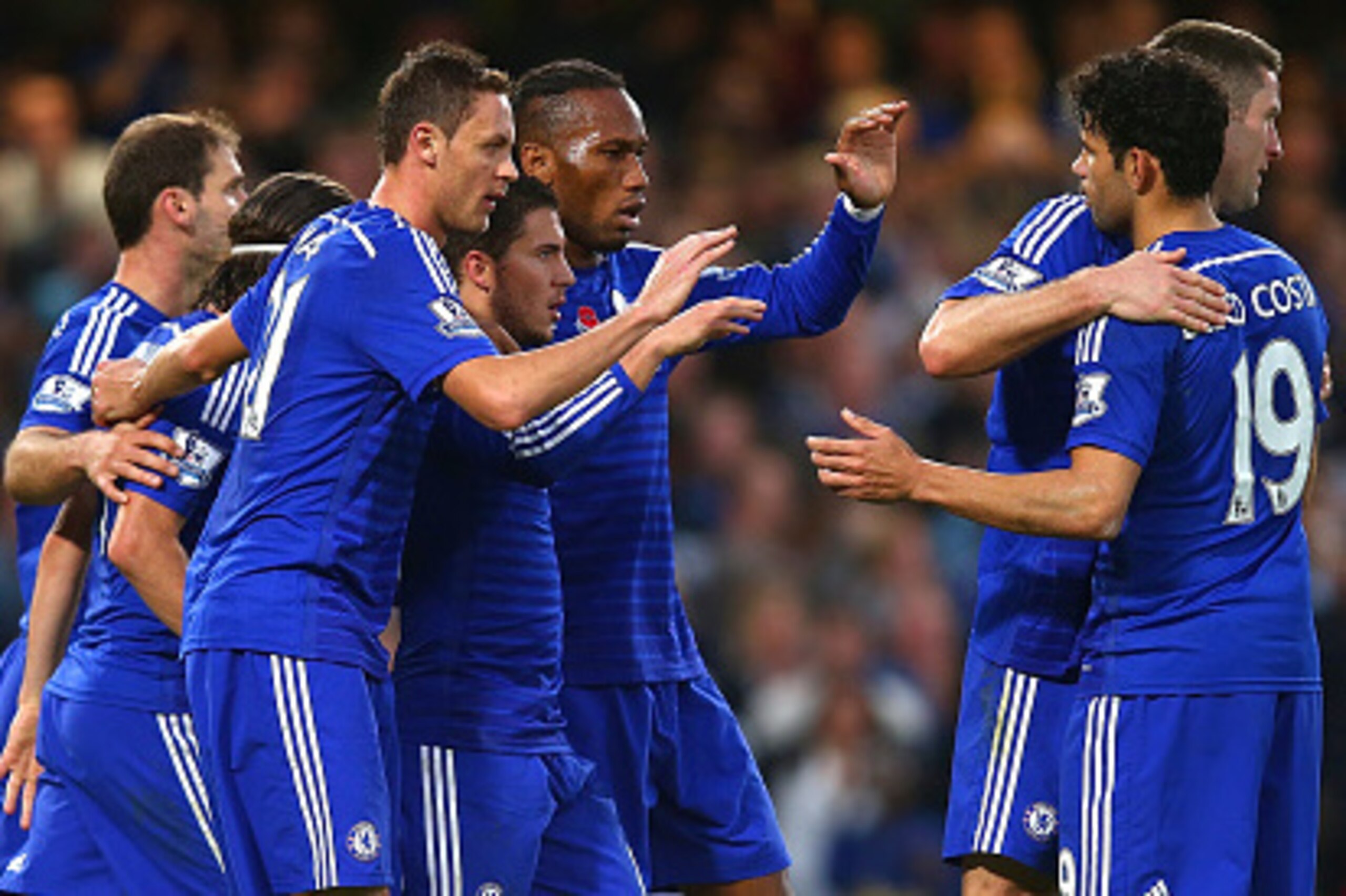 LONDON, ENGLAND - NOVEMBER 01: Goalscorer Eden Hazard (4th R) of Chelsea celebrates wtih his team during the Barclays Premier League match between Chelsea and Queens Park Rangers at Stamford Bridge on November 1, 2014 in London, England.  (Photo by Clive 