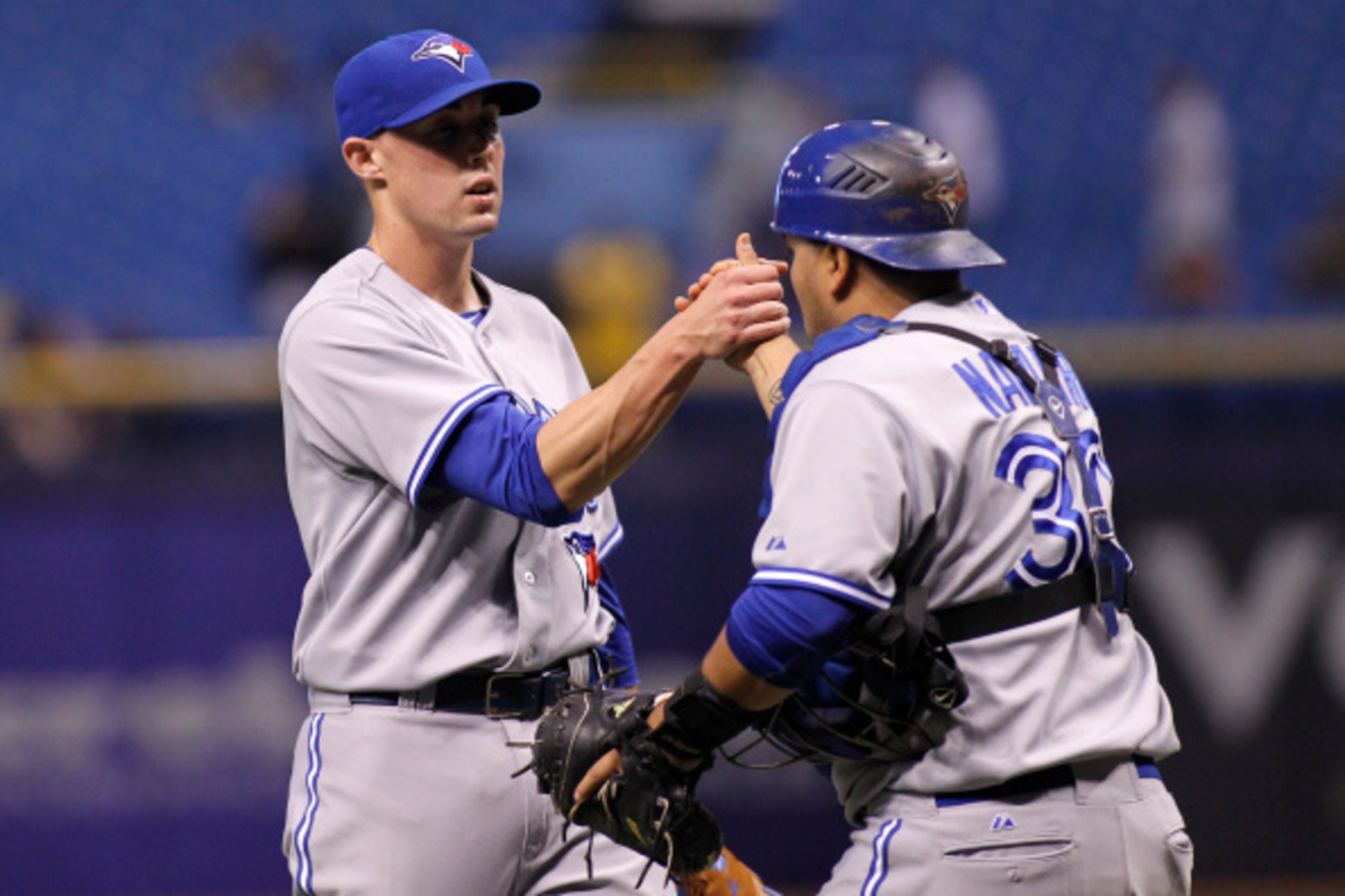 ST. PETERSBURG, FL - SEPTEMBER 3:  Pitcher Aaron Sanchez #41 of the Toronto Blue Jays celebrates with catcher Dioner Navarro #30 following the Blue Jays' 7-4 win over the Tampa Bay Rays on September 3, 2014 at Tropicana Field in St. Petersburg, Florida.  