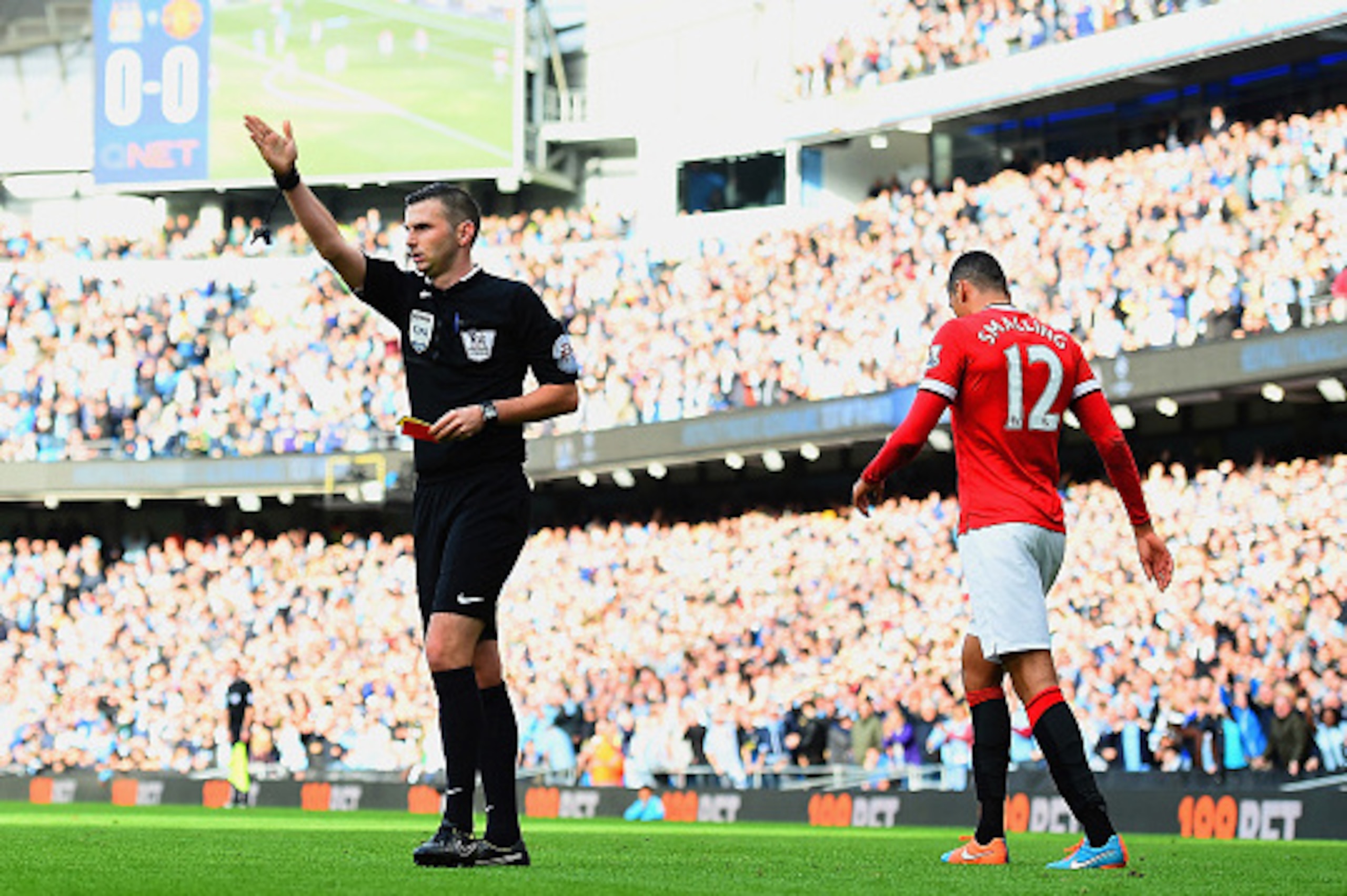 MANCHESTER, ENGLAND - NOVEMBER 02:  Chris Smalling of Manchester United leaves the field after receiving a red card by Referee Michael Oliver during the Barclays Premier League match between Manchester City and Manchester United at Etihad Stadium on Novem