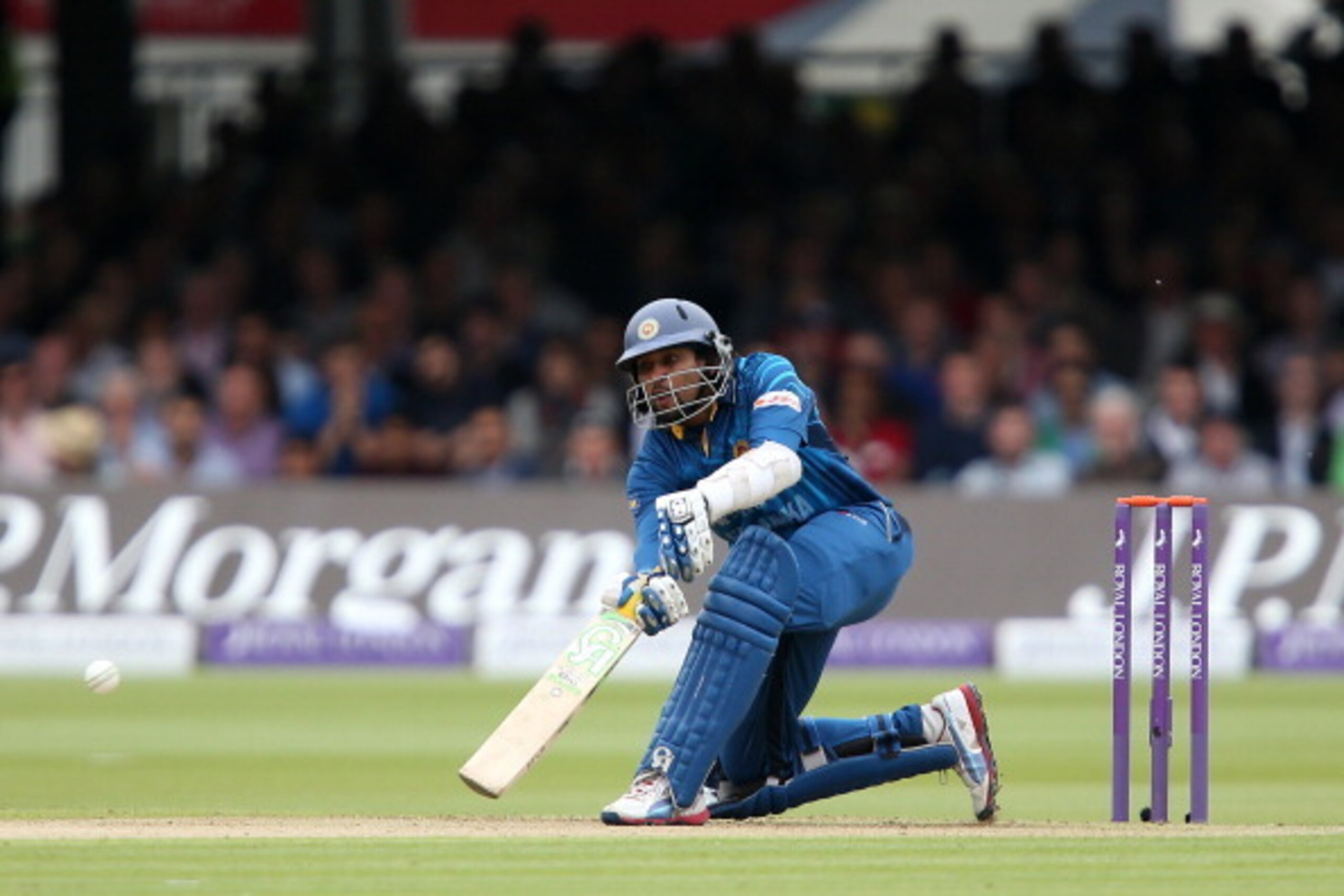 LONDON, ENGLAND - MAY 31:  Tillakaratne Dilshan plays a scoop shot off James Anderson of England during the 4th Royal London One Day International match between England and Sri Lanka at Lord's Cricket Ground on May 31, 2014 in London, England. (Photo by J