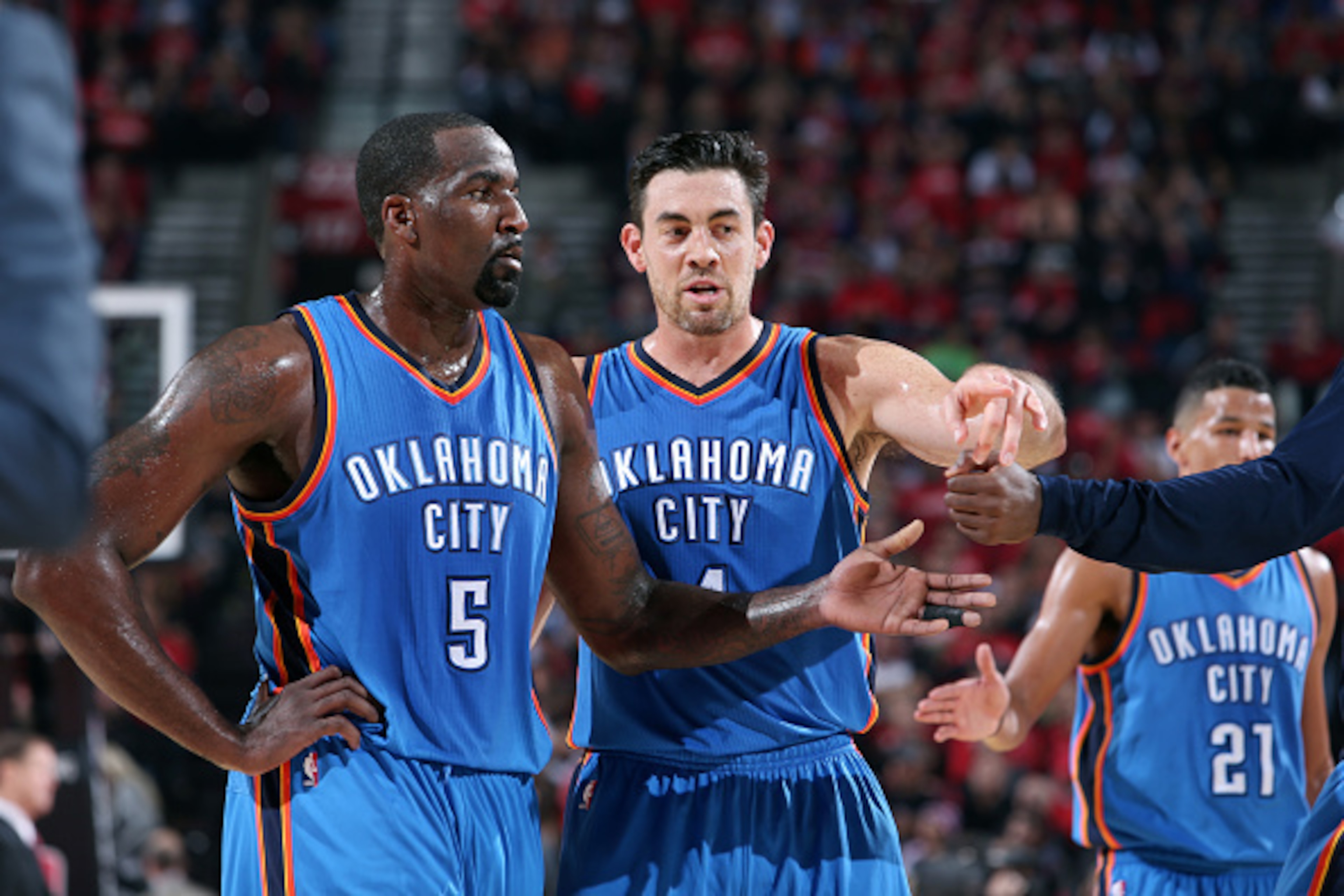 PORTLAND, OR - OCTOBER 29: Kendrick Perkins #5 and Nick Collison #4 of the Oklahoma City Thunder talk during a game against the Portland Trail Blazers on October 29, 2014 at the Moda Center Arena in Portland, Oregon. NOTE TO USER: User expressly acknowled