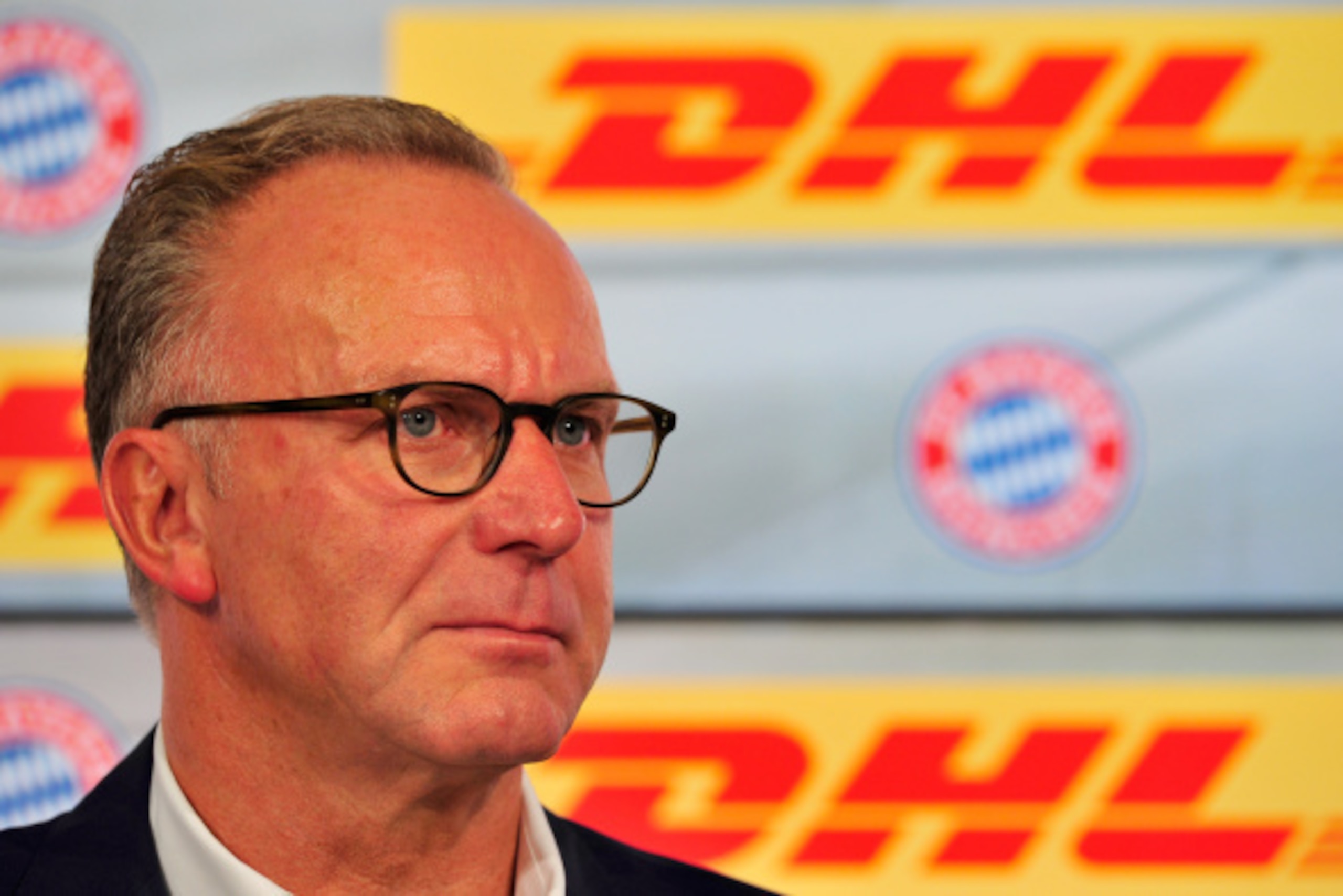 MUNICH, GERMANY - AUGUST 22: Karl-Heinz Rummenigge, CEO of FC Bayern Muenchen AG, addresses the media during a press conference on the new partnership between FC Bayern Muenchen and DHL at Allianz Arena on August 22, 2014 in Munich, Germany. (Photo by L MUNICH, GERMANY - AUGUST 22: Karl-Heinz Rummenigge, CEO of FC Bayern Muenchen AG, addresses the media during a press conference on the new partnership between FC Bayern Muenchen and DHL at Allianz Arena on August 22, 2014 in Munich, Germany. (Photo by L