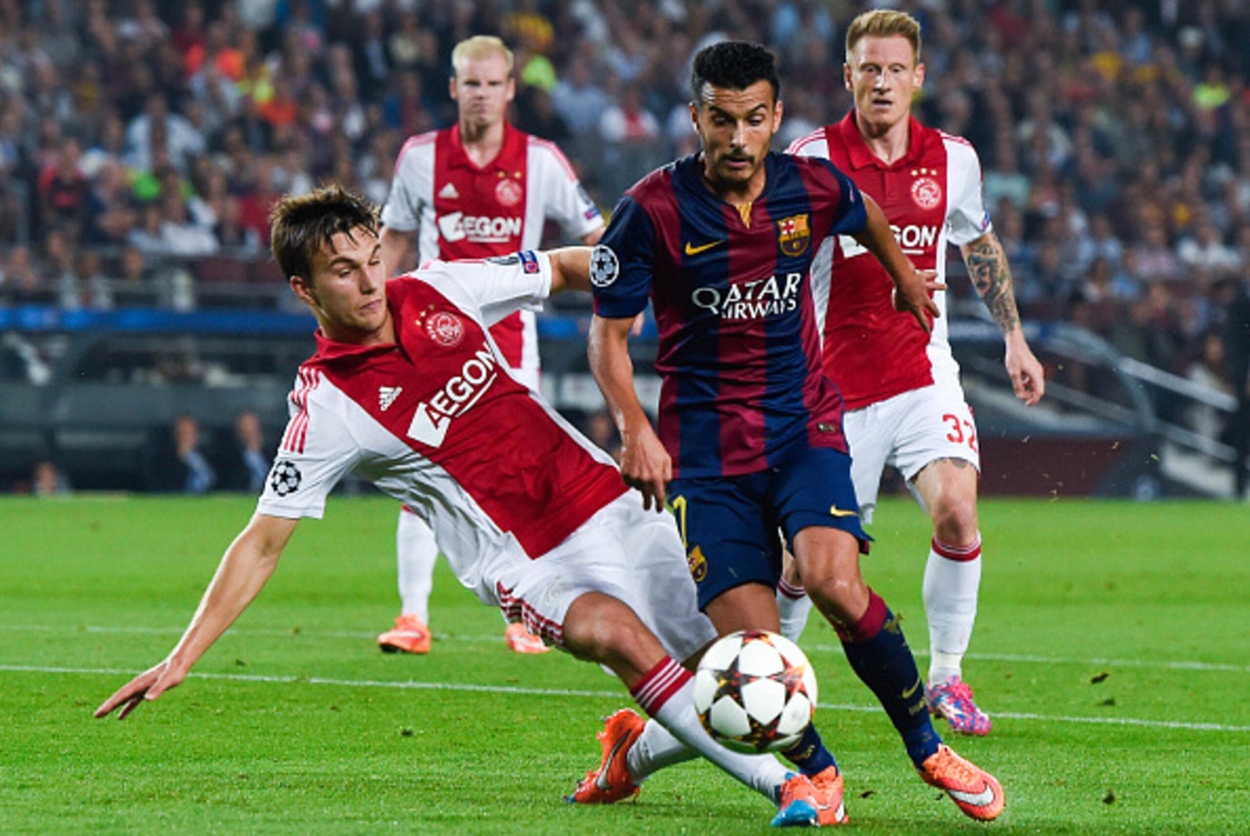 BARCELONA, SPAIN - OCTOBER 21: Pedro Rodriguez of FC Barcelona competes for the ball with Joel Veltman of AFC Ajax during a UEFA Champions League Group F match between FC Barcelona and AFC Ajax at the Camp Nou Stadium on October 21, 2014 in Barcelona, Spa BARCELONA, SPAIN - OCTOBER 21: Pedro Rodriguez of FC Barcelona competes for the ball with Joel Veltman of AFC Ajax during a UEFA Champions League Group F match between FC Barcelona and AFC Ajax at the Camp Nou Stadium on October 21, 2014 in Barcelona, Spa