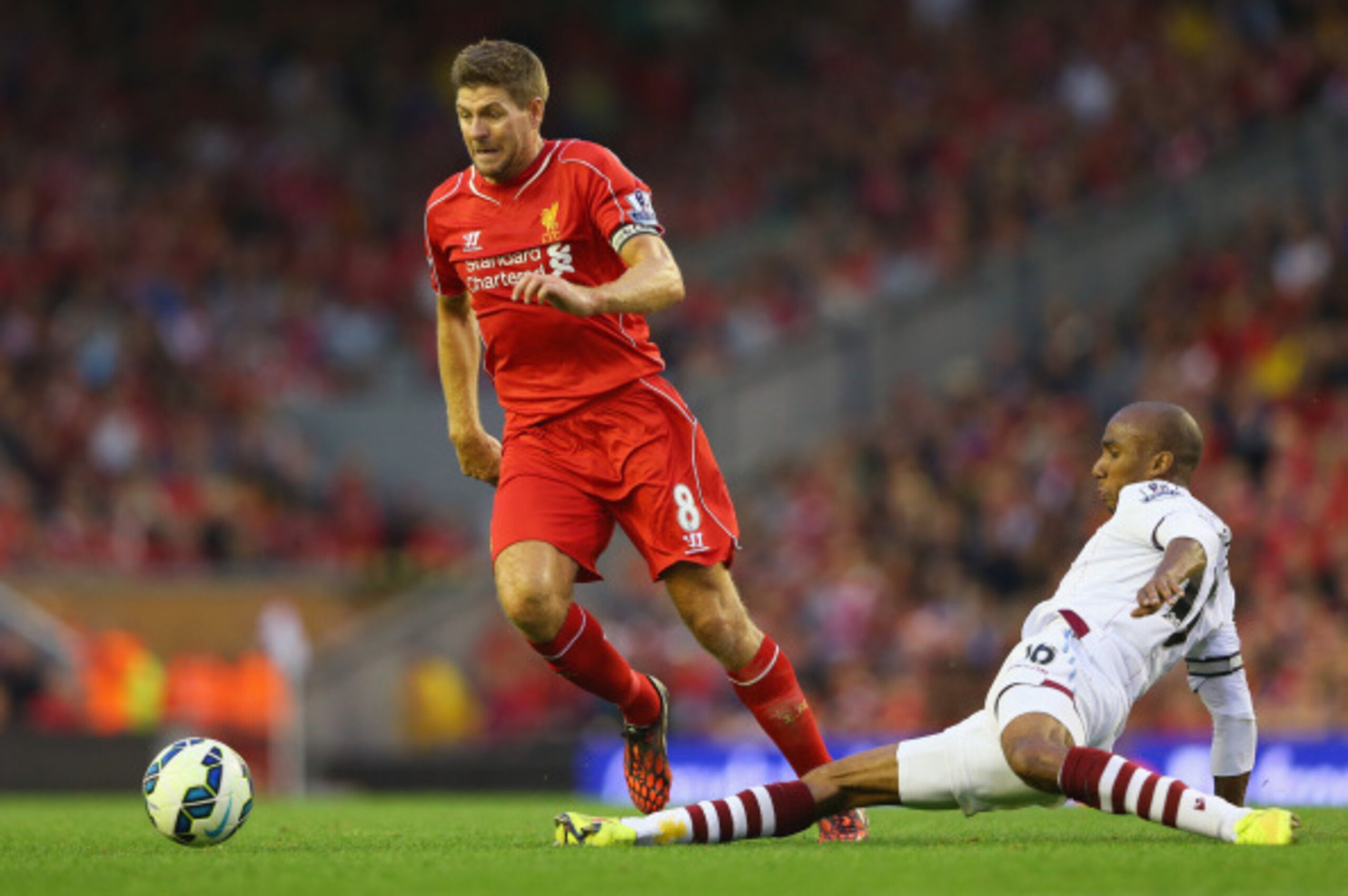 LIVERPOOL, ENGLAND - SEPTEMBER 13: Steven Gerrard of Liverpool is tackled by Fabian Delph of Aston Villa during the Barclays Premier League match between Liverpool and Aston Villa at Anfield on September 13, 2014 in Liverpool, England. (Photo by Alex Liv LIVERPOOL, ENGLAND - SEPTEMBER 13: Steven Gerrard of Liverpool is tackled by Fabian Delph of Aston Villa during the Barclays Premier League match between Liverpool and Aston Villa at Anfield on September 13, 2014 in Liverpool, England. (Photo by Alex Liv