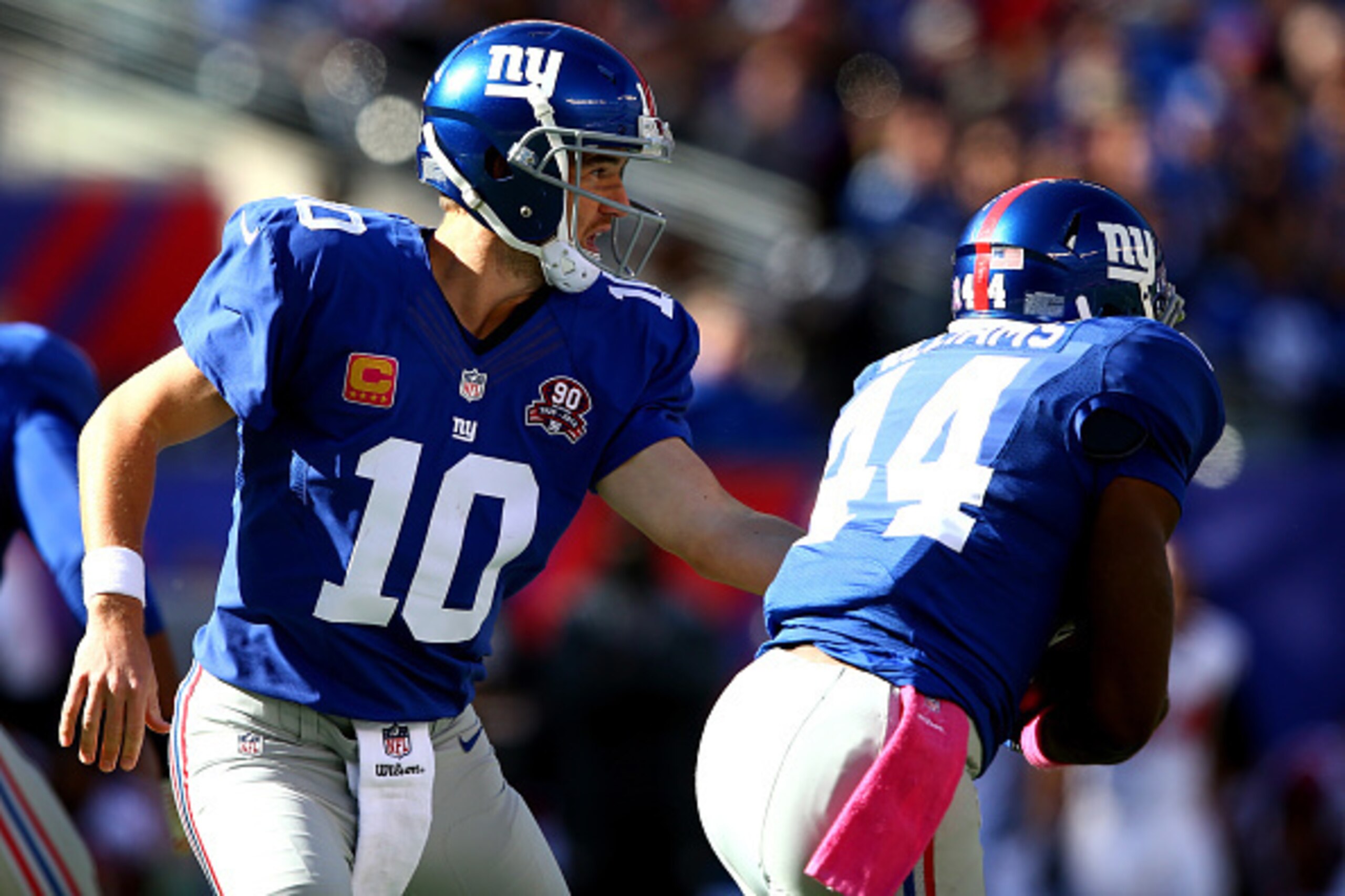 EAST RUTHERFORD, NJ - OCTOBER 05:  Quarterback Eli Manning #10 of the New York Giants hands the ball offsides turnover running back Andre Williams #44 in the fourth quarter against the Atlanta Falcons during their game at MetLife Stadium on October 5, 201